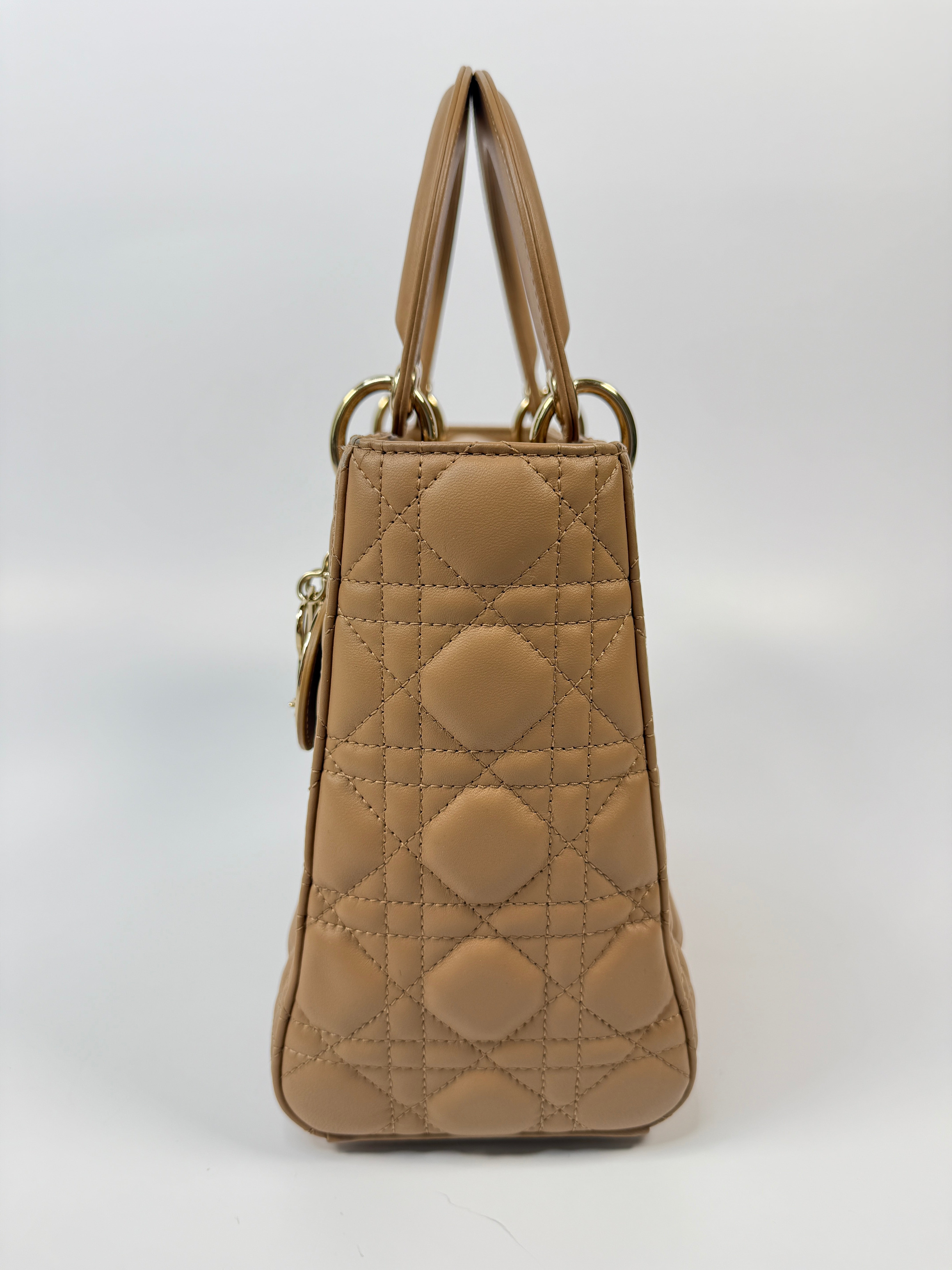 Authentic pre-loved Christian Dior Medium Lady Dior Bag in gold with gold hardware