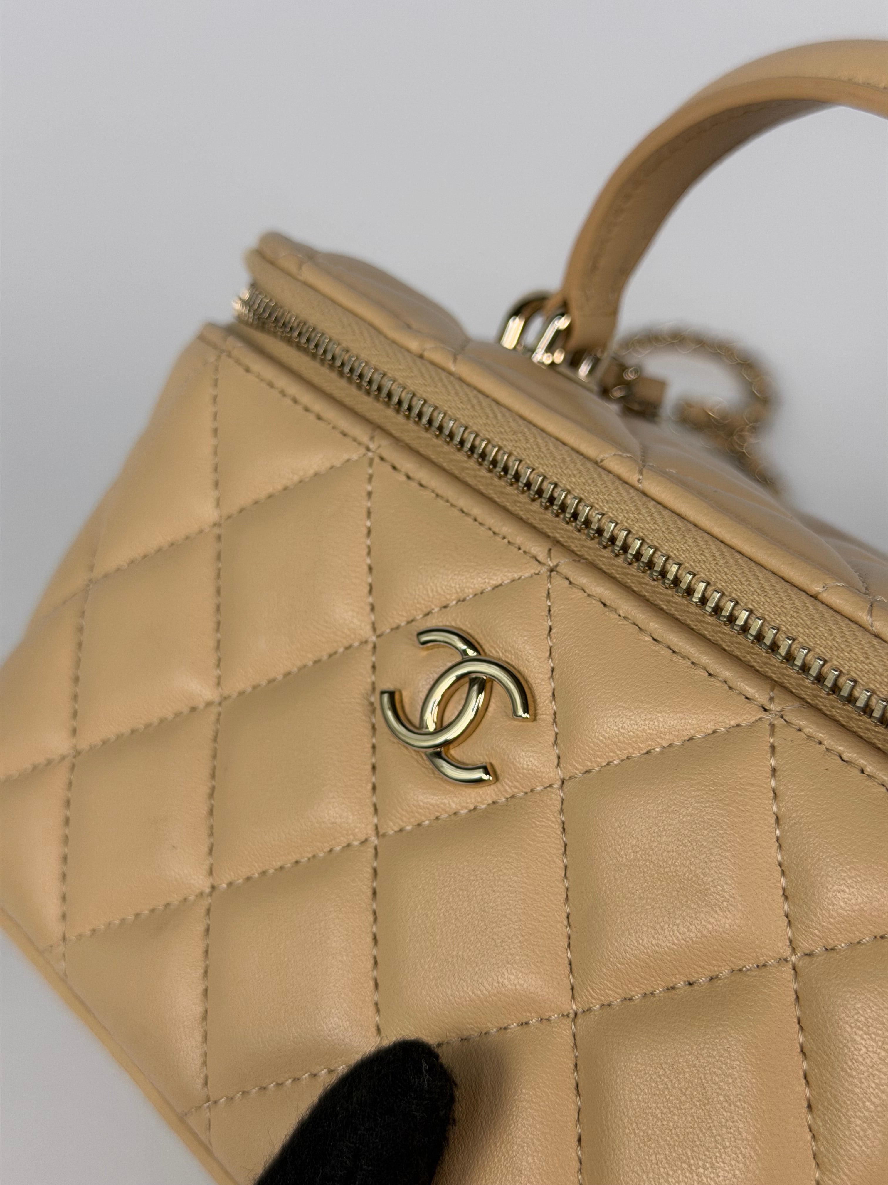 Chanel Mini Vanity Top Handle In Light Beige Lambskin Leather With Gold Hardware. Authentic and preloved in excellent condition. Insured next day delivery. Verified by Luxe Cheshire