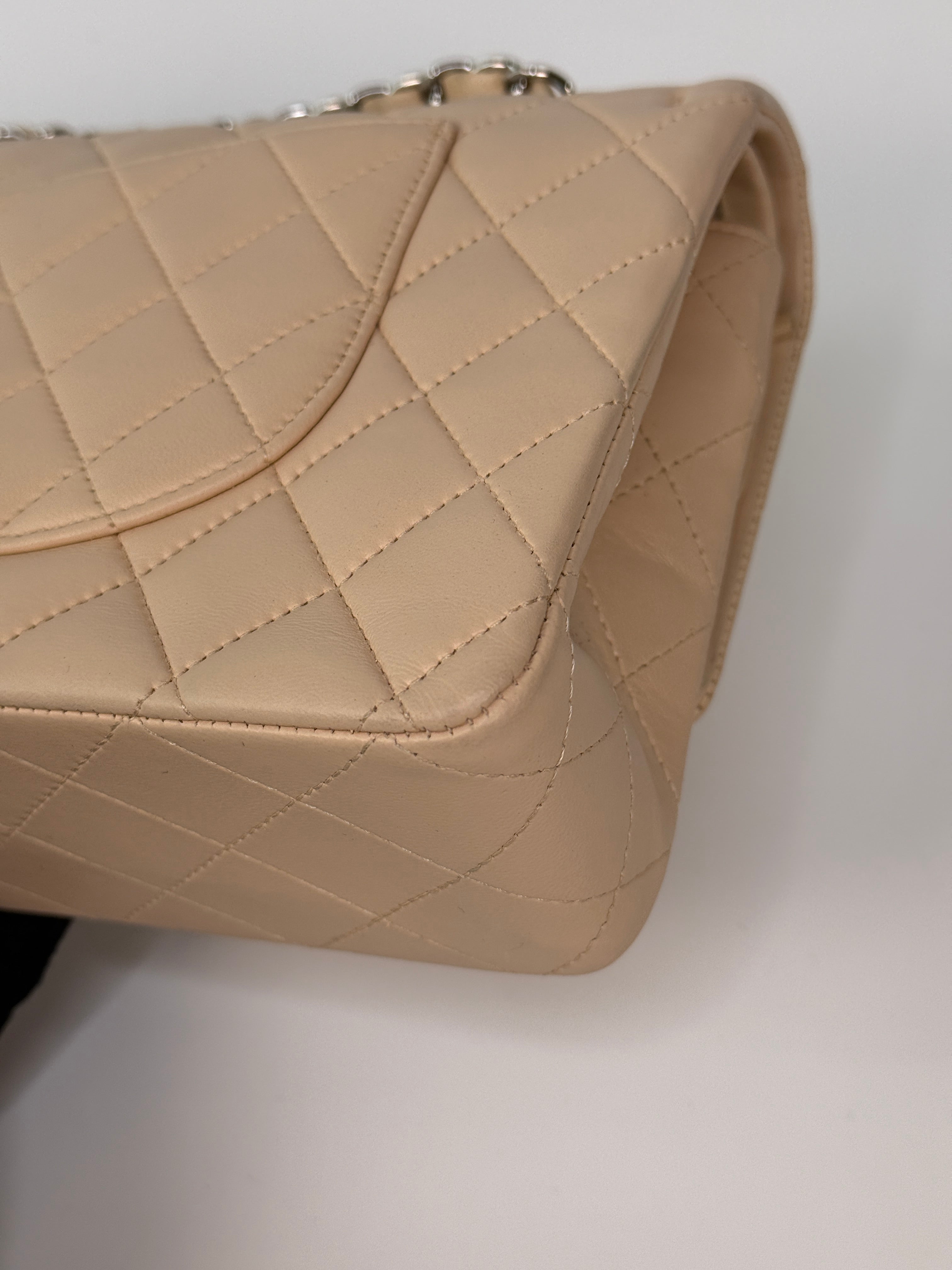 Authentic and preloved Chanel Medium Classic Double Flap Light Beige Lambskin Leather With Silver Hardware