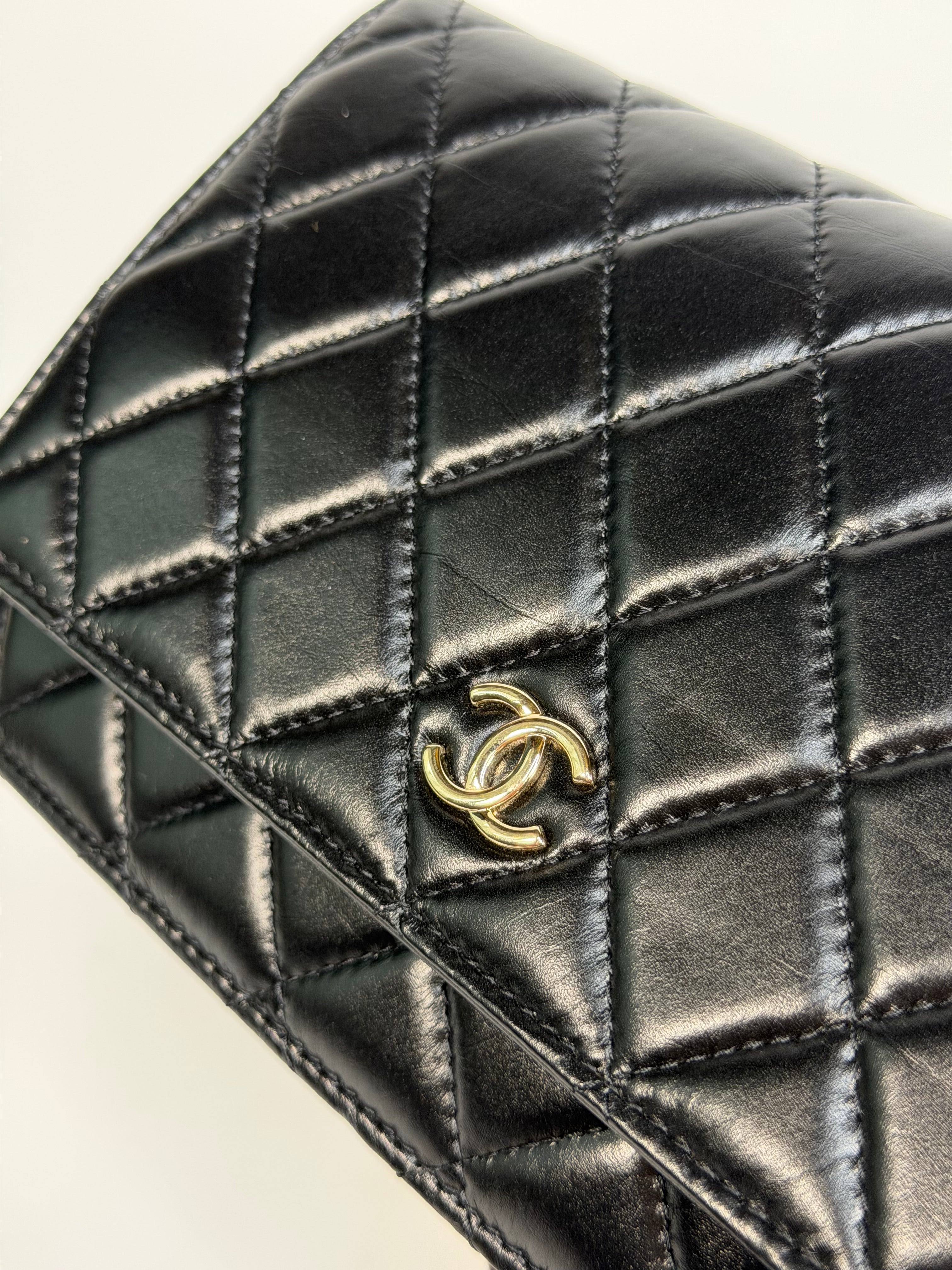 Chanel Pearl Wallet On Chain In Black Lambskin Leather With Gold Hardware. Authentic and preloved in very good condition.