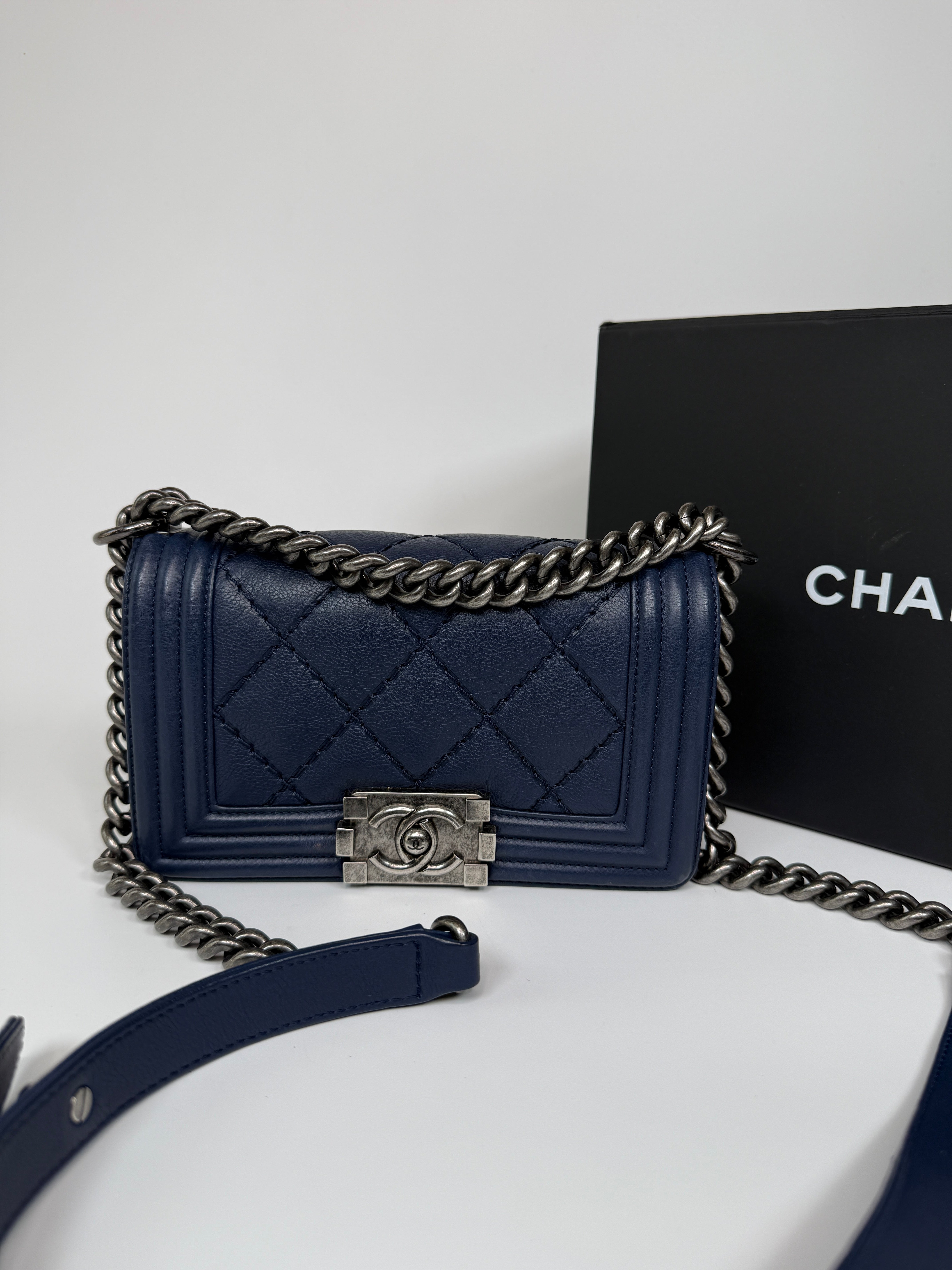 Chanel Mini Boy Bag In Navy Lambskin With Ruthenium Hardware In Excellent Condition.
Authentic Pre Loved Verified by Luxe Cheshire Trusted Designer resale