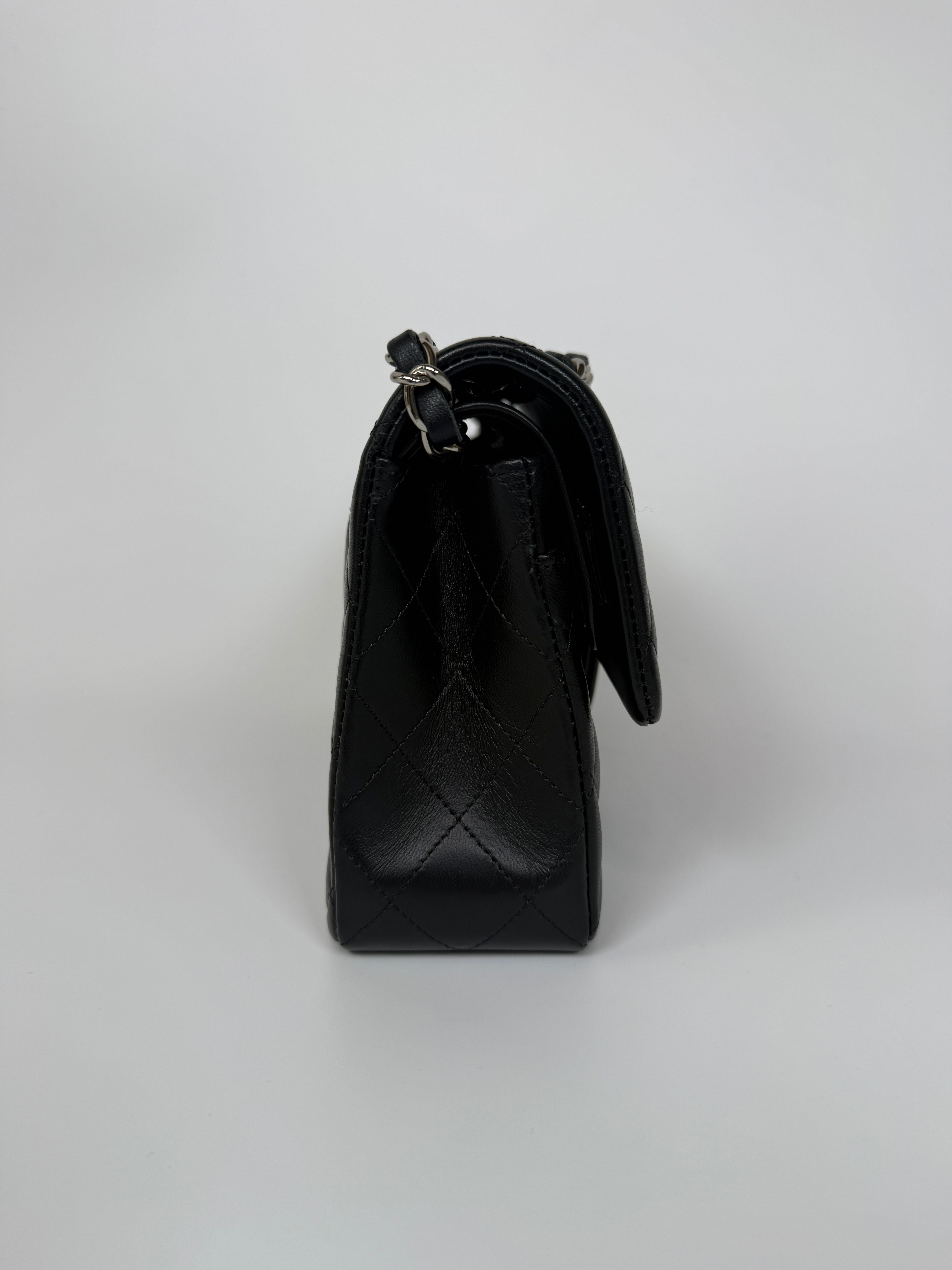 Authentic and preloved Chanel Small Classic Double Flap In Black Lambskin Leather With Silver hardware 100% Authenticity guarantee