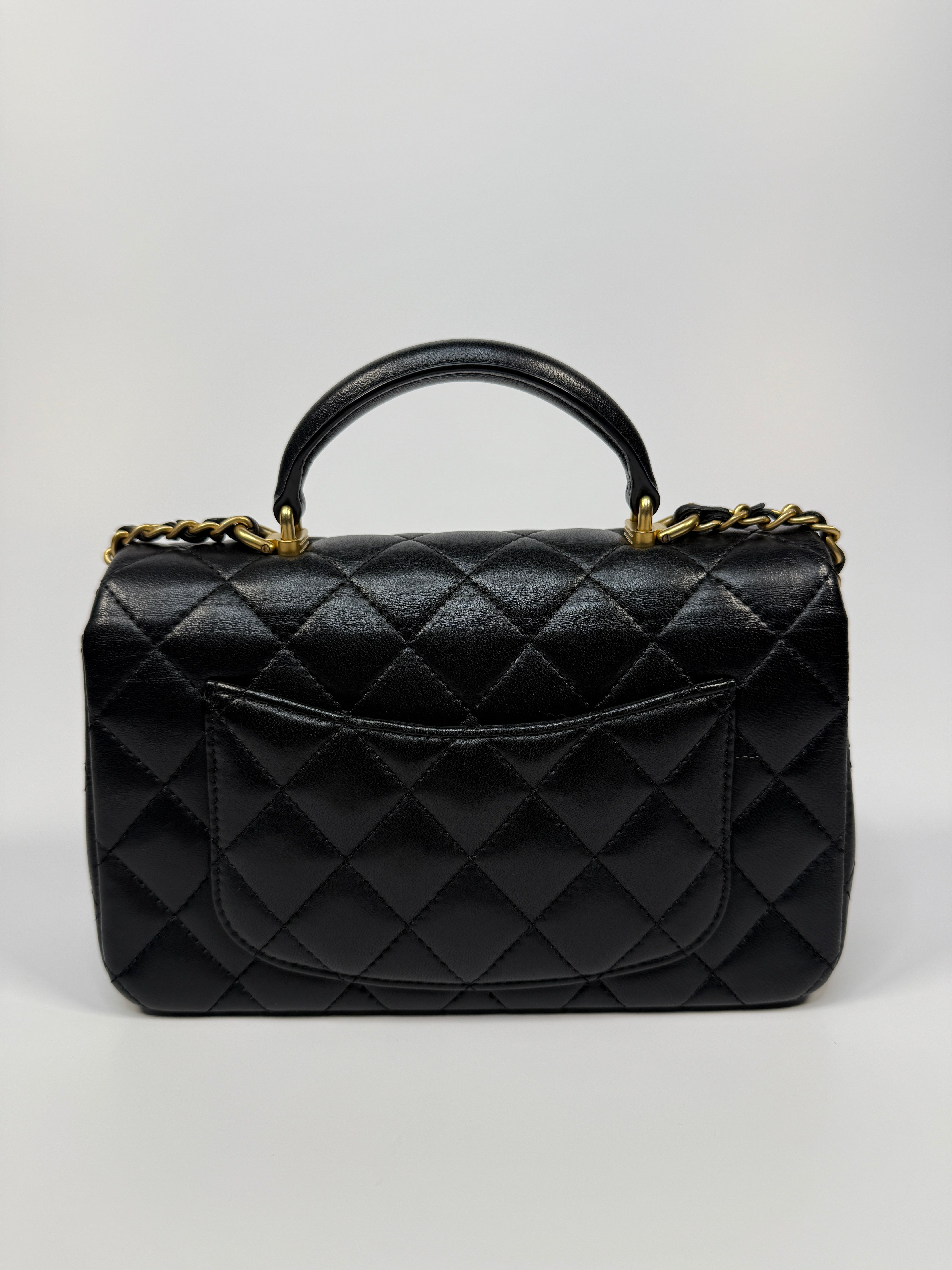 Chanel Mini Rectangle Top Handle Flap Bag In Black Lambskin With Gold Hardware
Pre Loved & Authentic