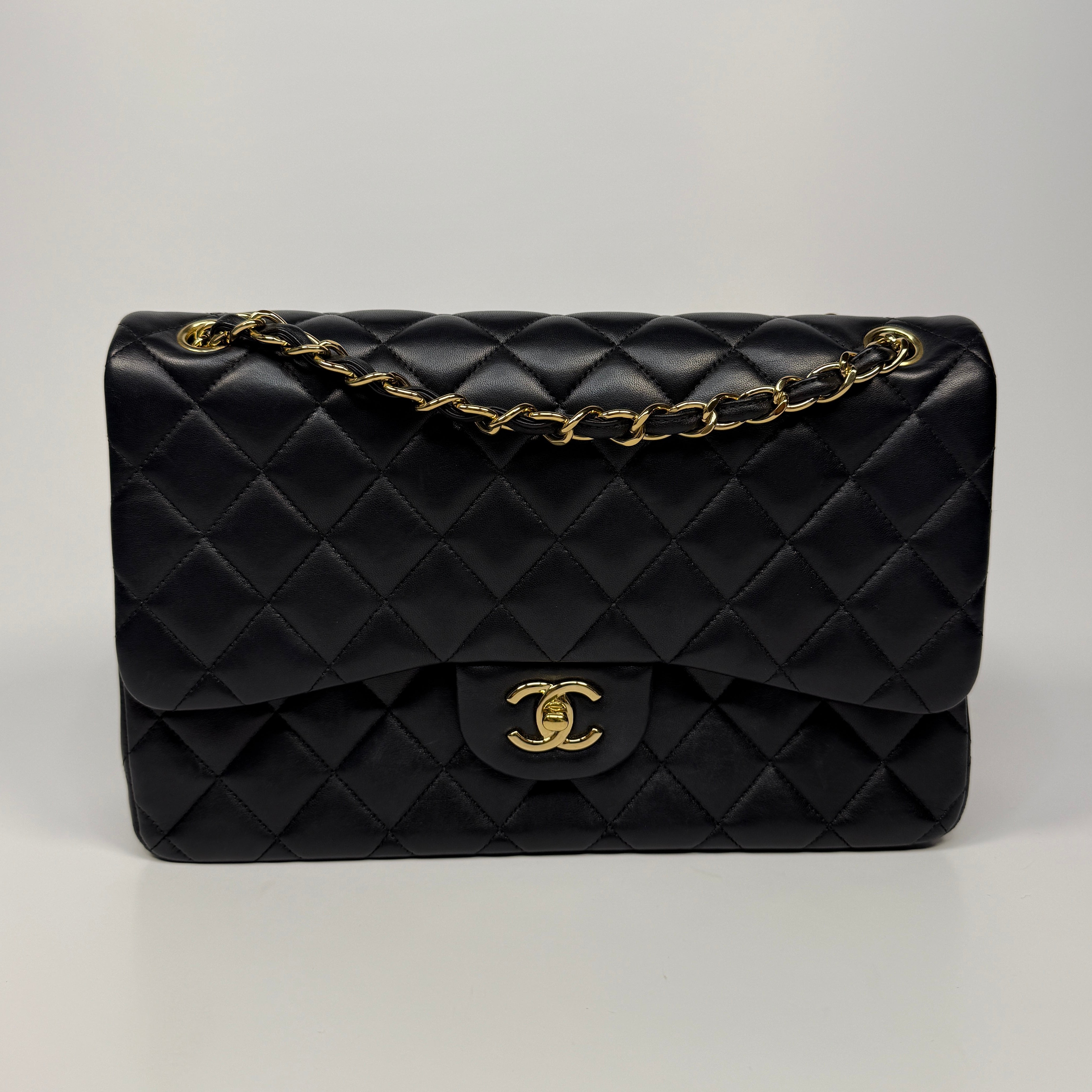 Chanel Jumbo Classic Flap Bag In Black Lambskin Leather With Gold Hardware
Pre Loved & Authentic