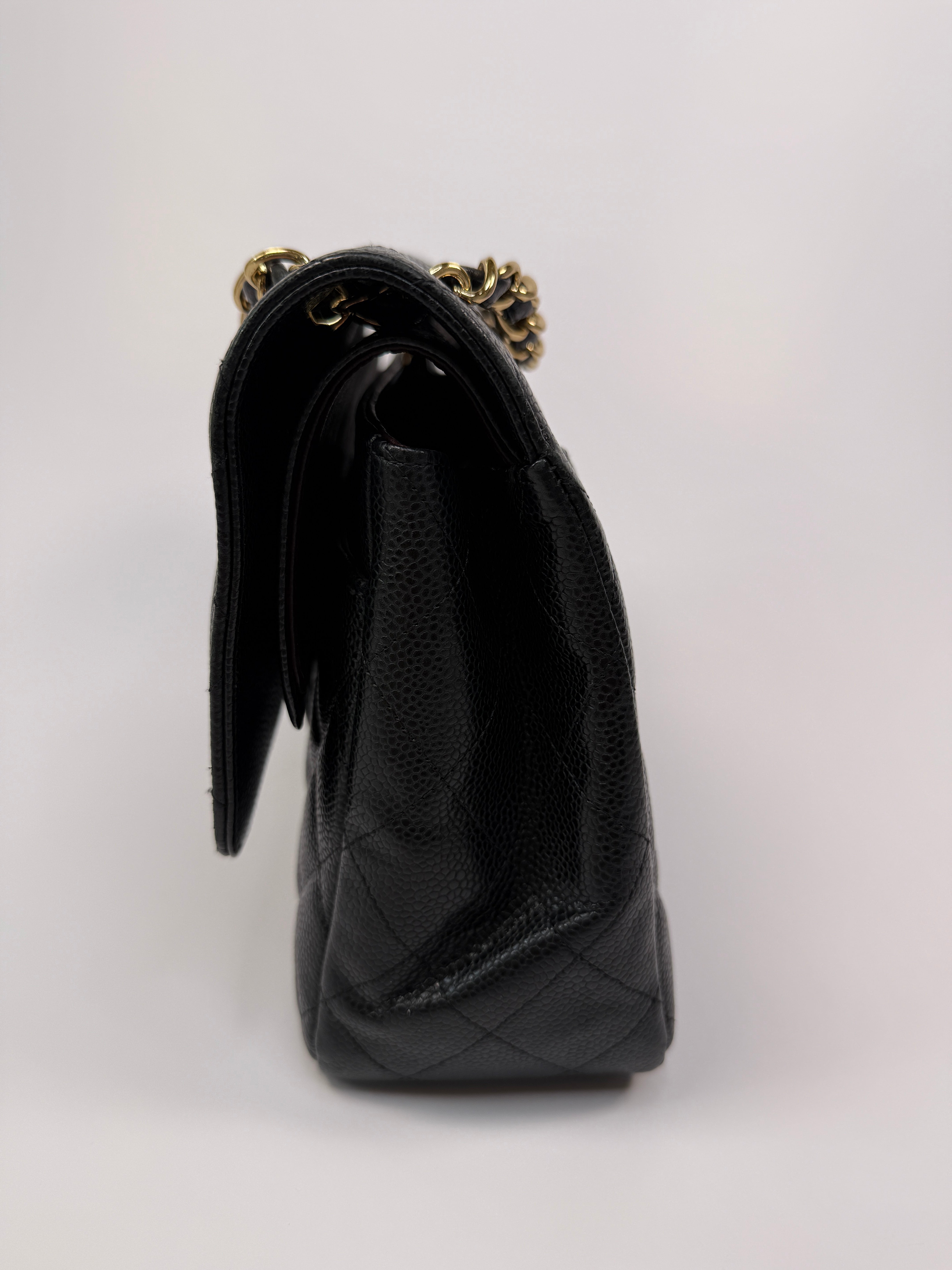 Chanel Classic Jumbo Flap Bag In Black Caviar LeatherWith Gold Hardware
Pre Loved & Authentic