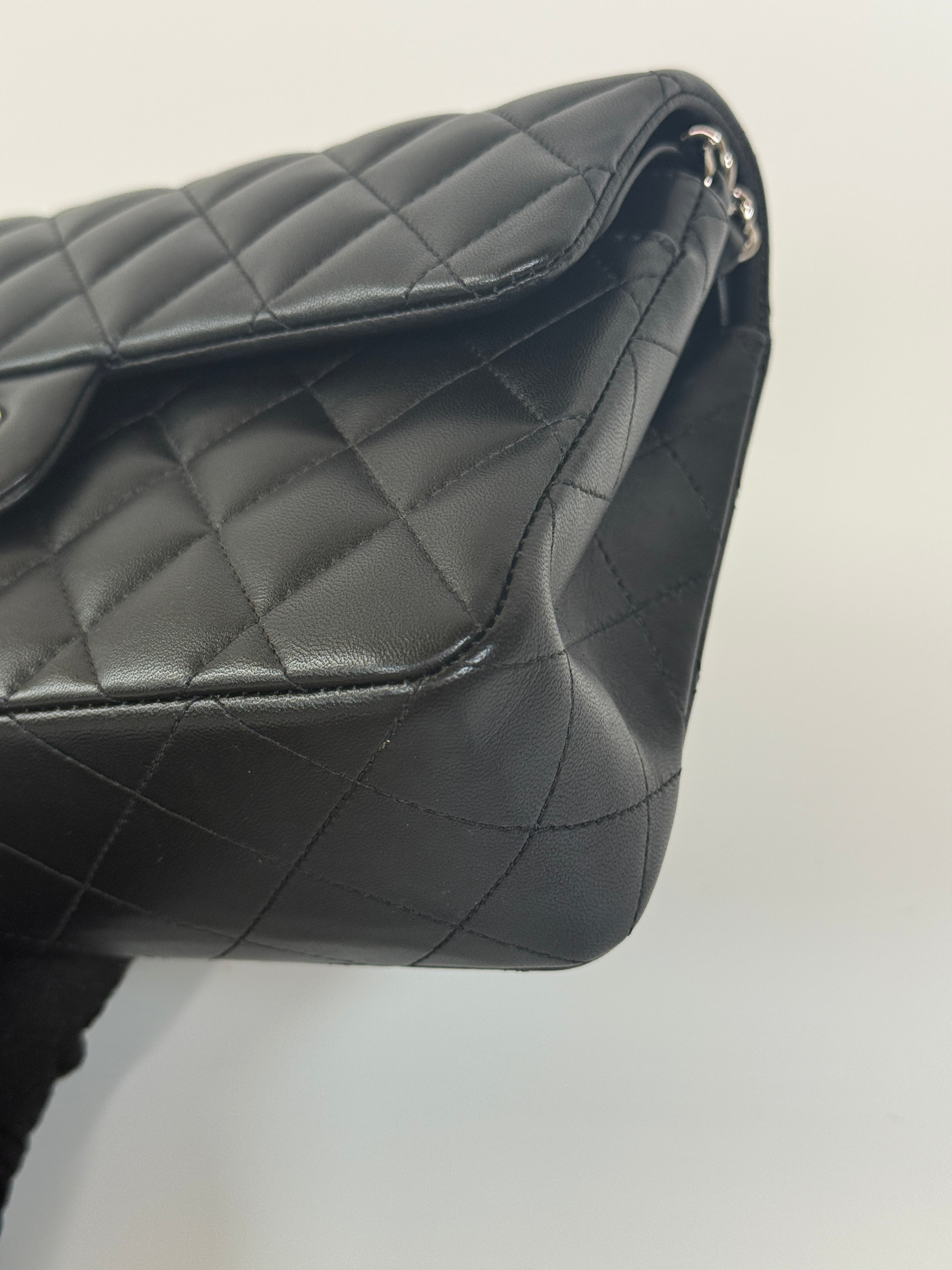 Chanel Small Classic Double Flap In Black Lambskin Leather With Silver Hardware Authentic and preloved in excellent condition. 100% Authenticity guarantee