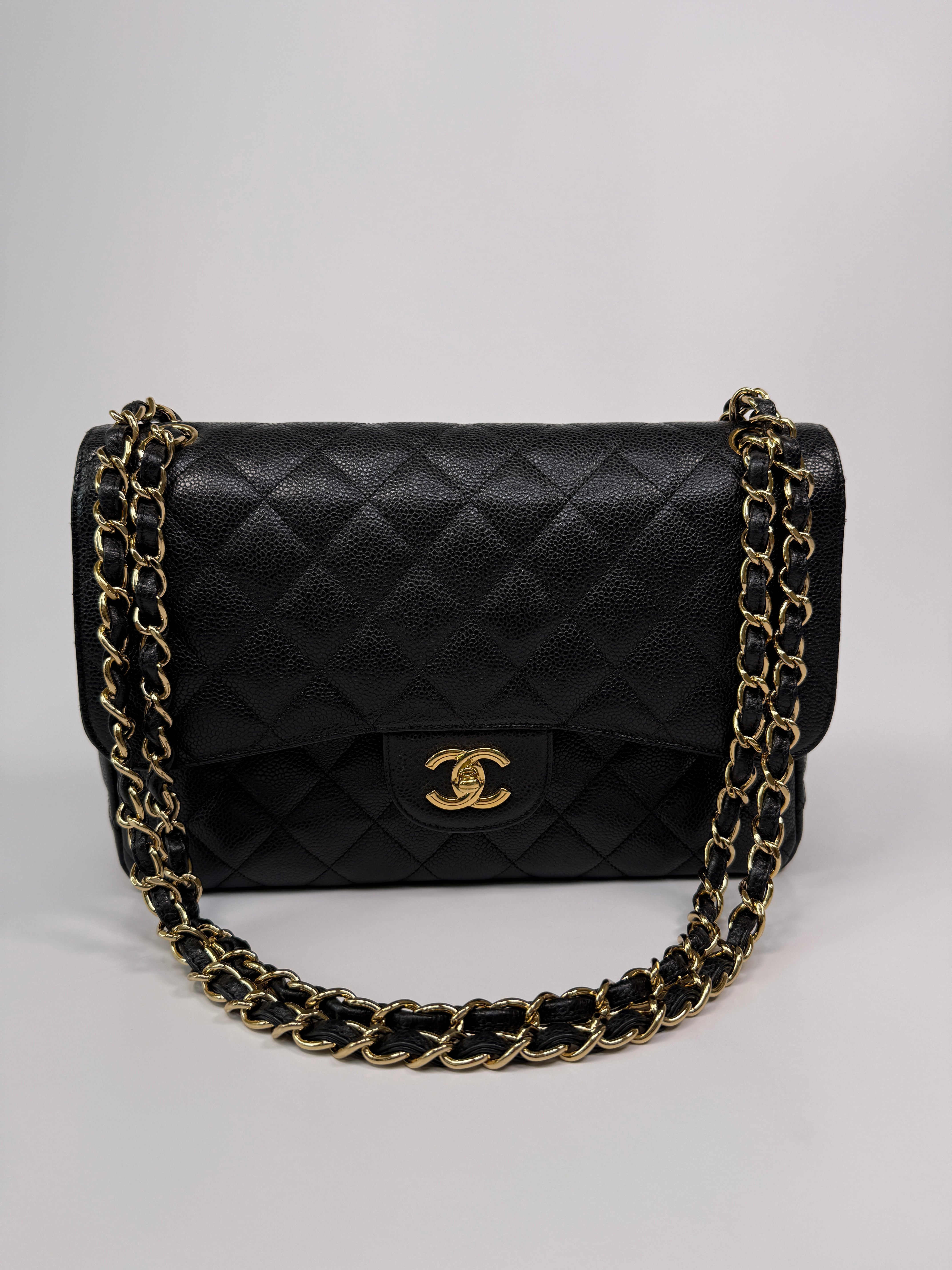 Chanel Classic Jumbo Flap Bag In Black Caviar LeatherWith Gold Hardware
Pre Loved & Authentic