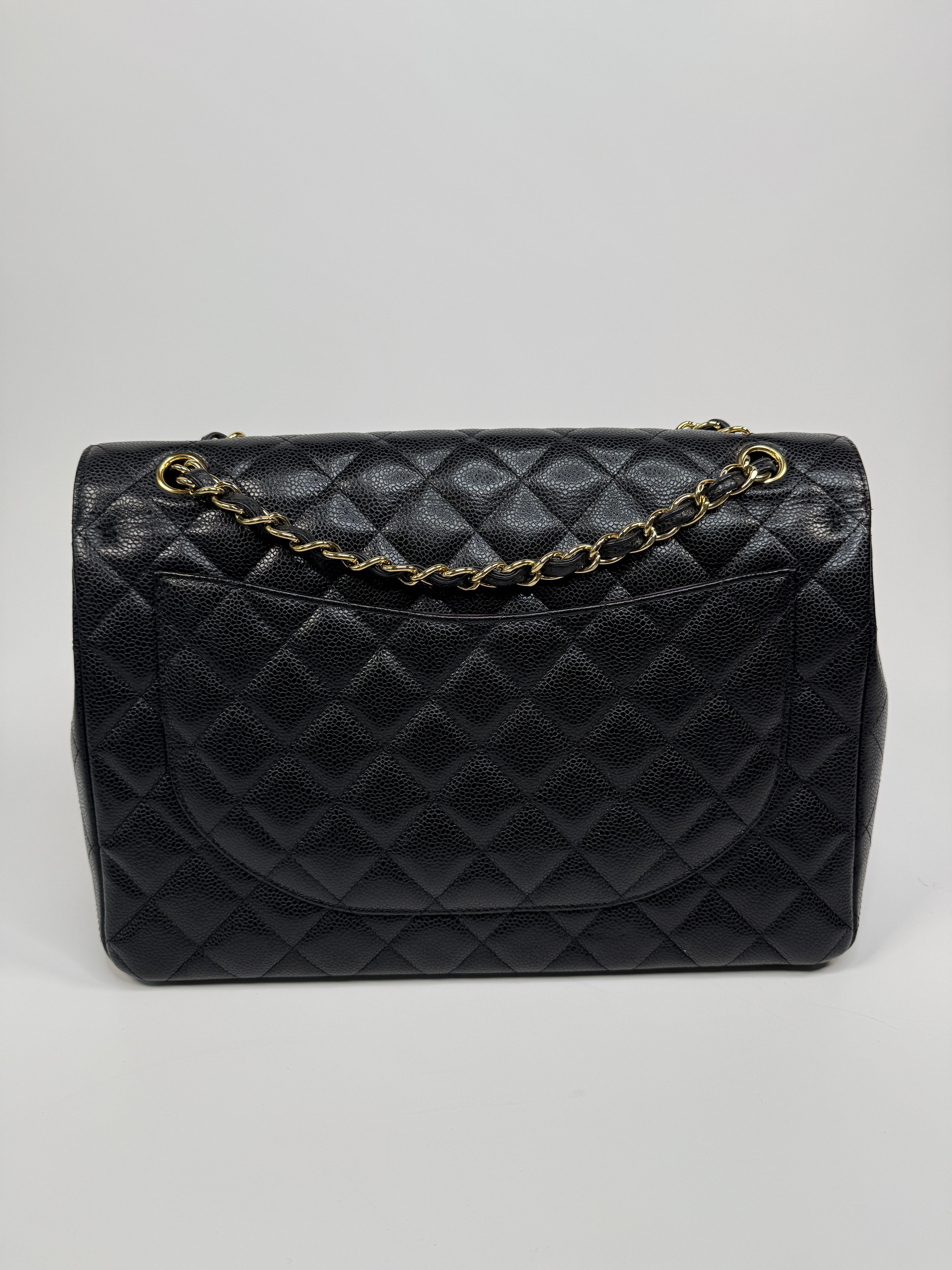 Chanel Maxi Classic Double Flap In Black Caviar Leather With Gold Hardware
Pre Loved & Authentic