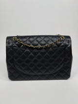 Chanel Maxi Classic Double Flap In Black Caviar Leather With GHW