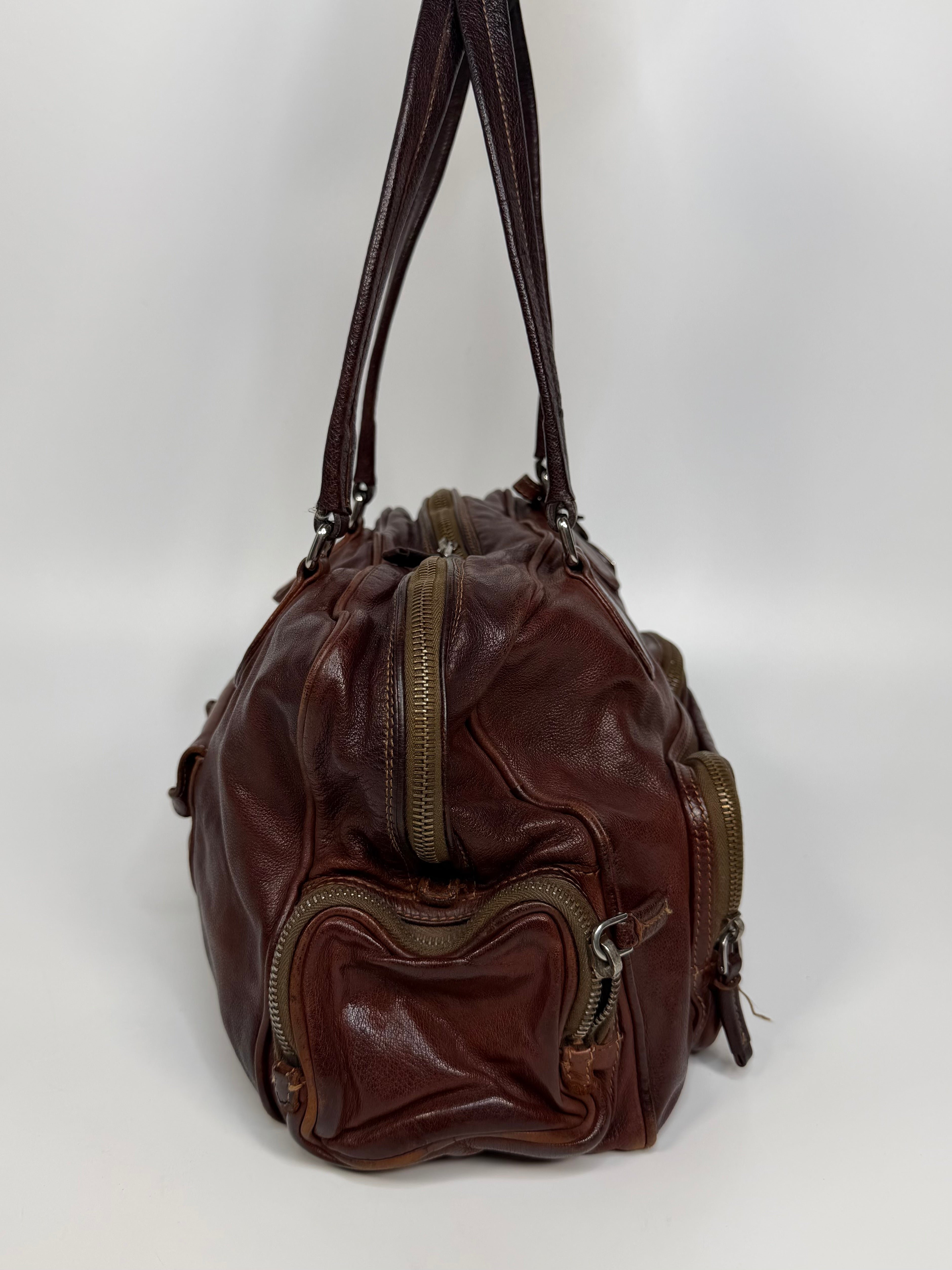 Prada Washed Bauletto Shoulder Bag In Brown Leather With Gold Hardware. Authentic and preloved in very good condition