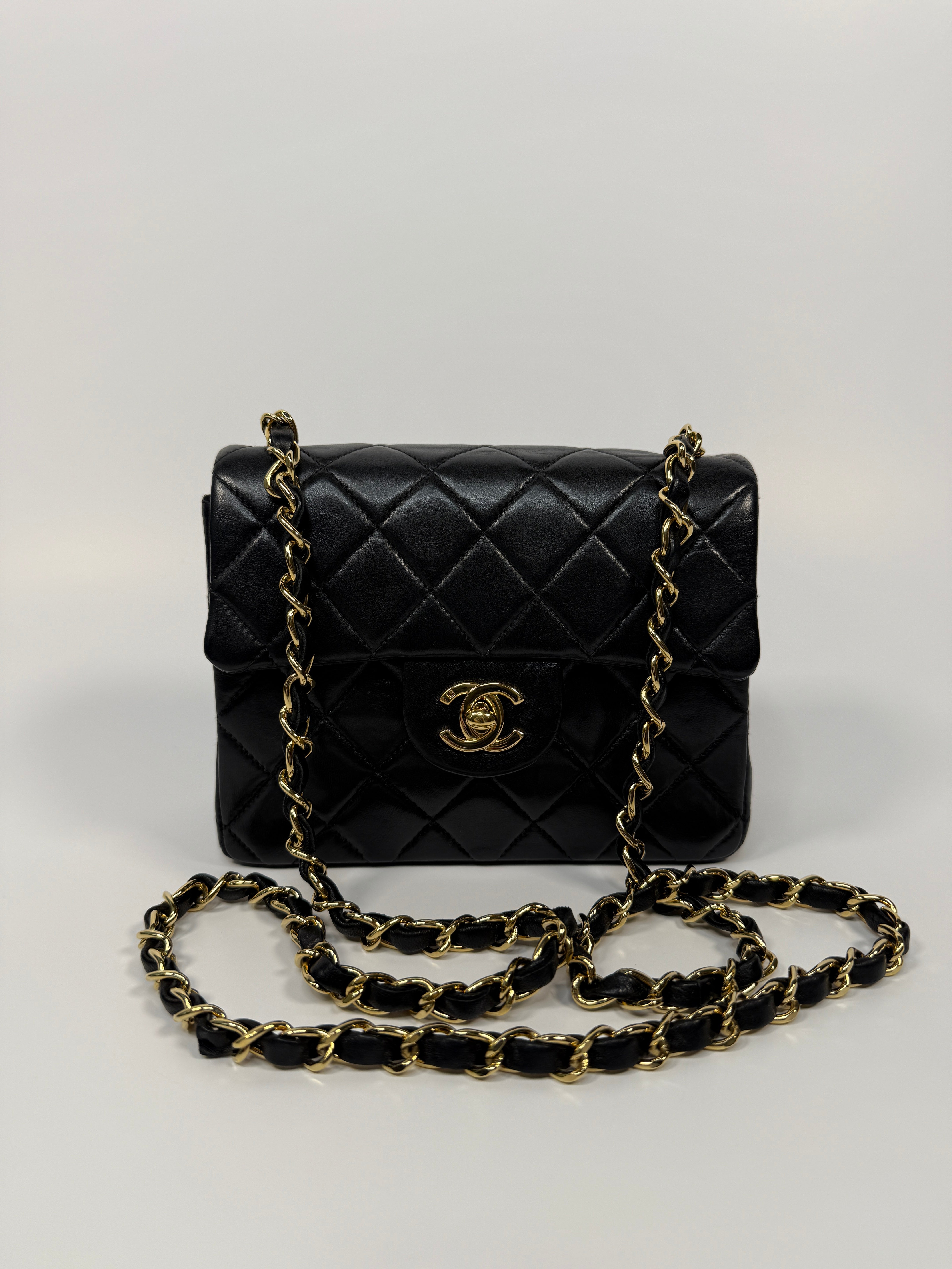Chanel Black Square Vintage Flap Bag In Lambskin With Gold Hardware
Pre Loved & Authentic