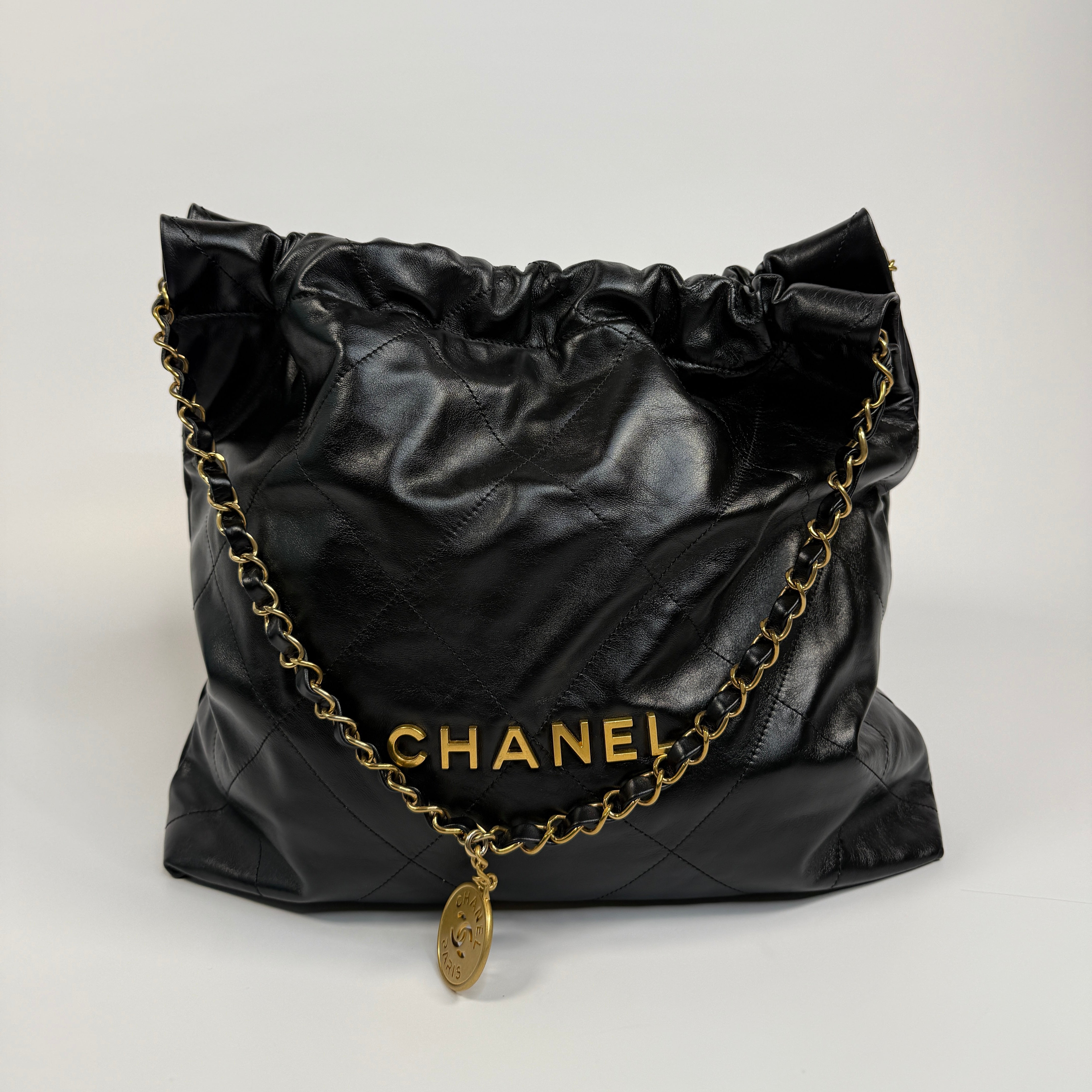Chanel 22 Handbag In Black Calfskin Leather With Gold Hardware. Excellent Condition. Authentic and Preloved
