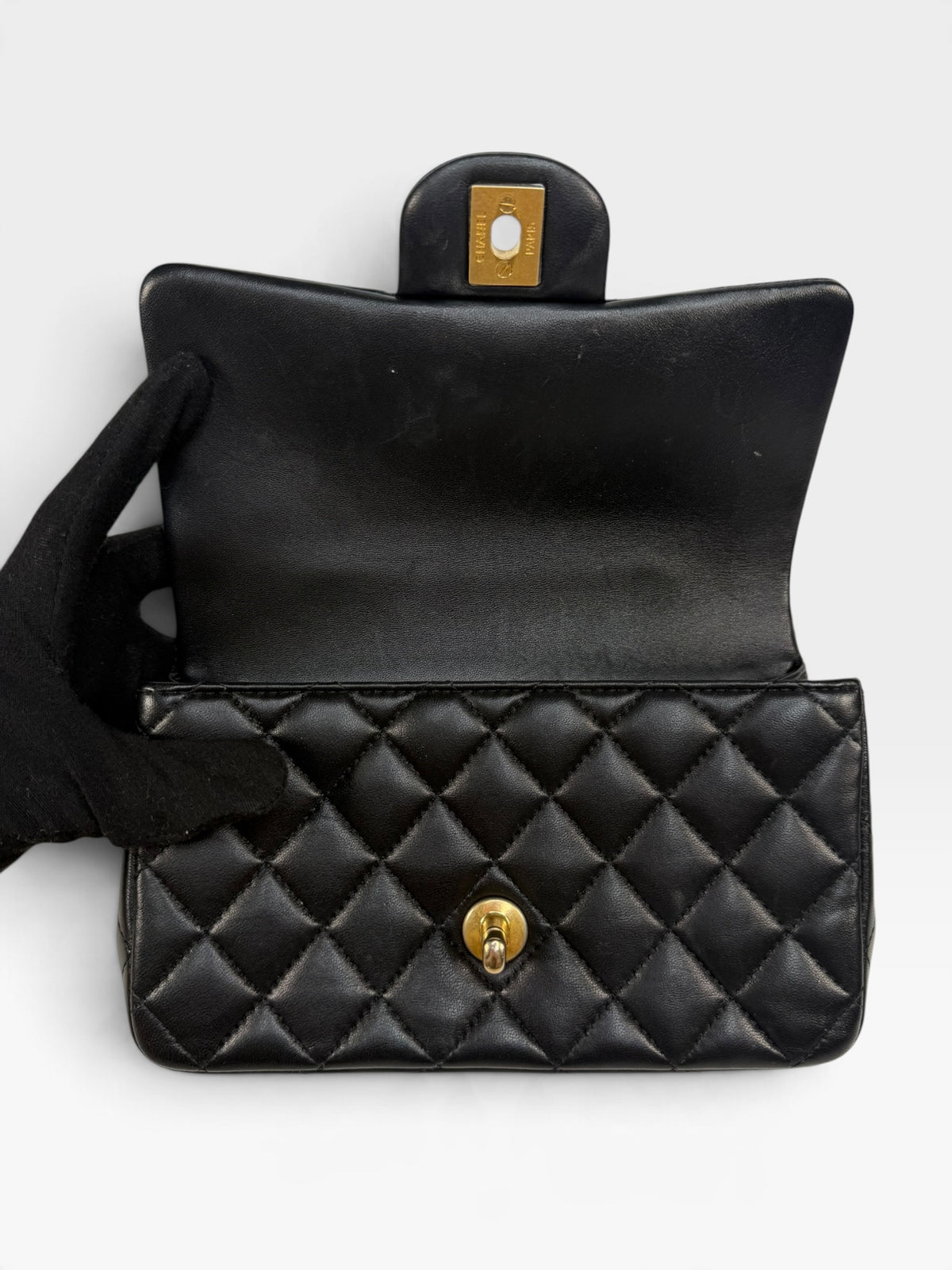 Chanel Mini Rectangle Top Handle In Black Lambskin With Gold Hardware. 100% authentic and pre loved in excellent condition.