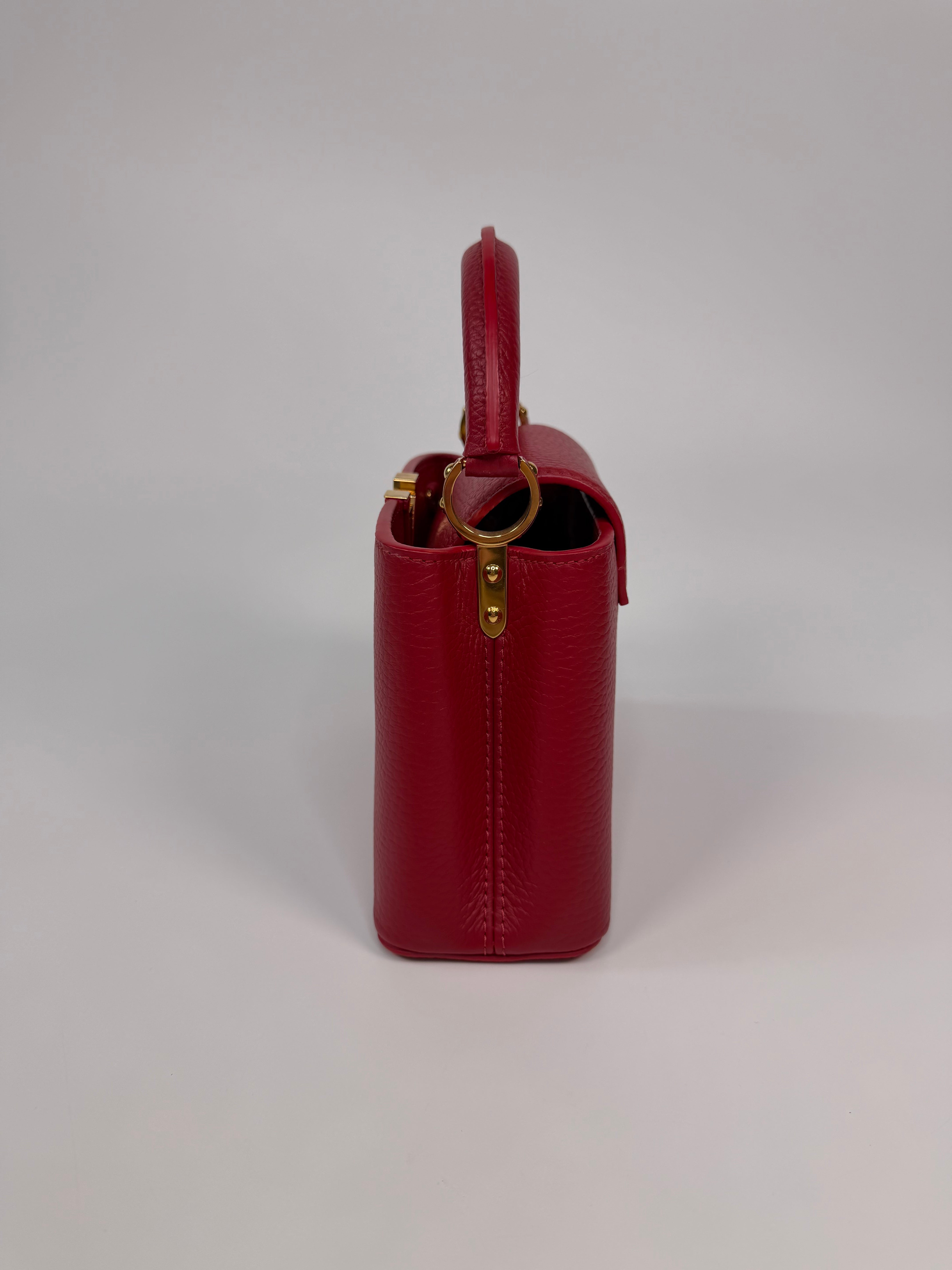 Louis Vuitton Capucines BB Bag In Scarlet Taurillion Leather With Gold Hardware. Authentic and preloved in excellent condition