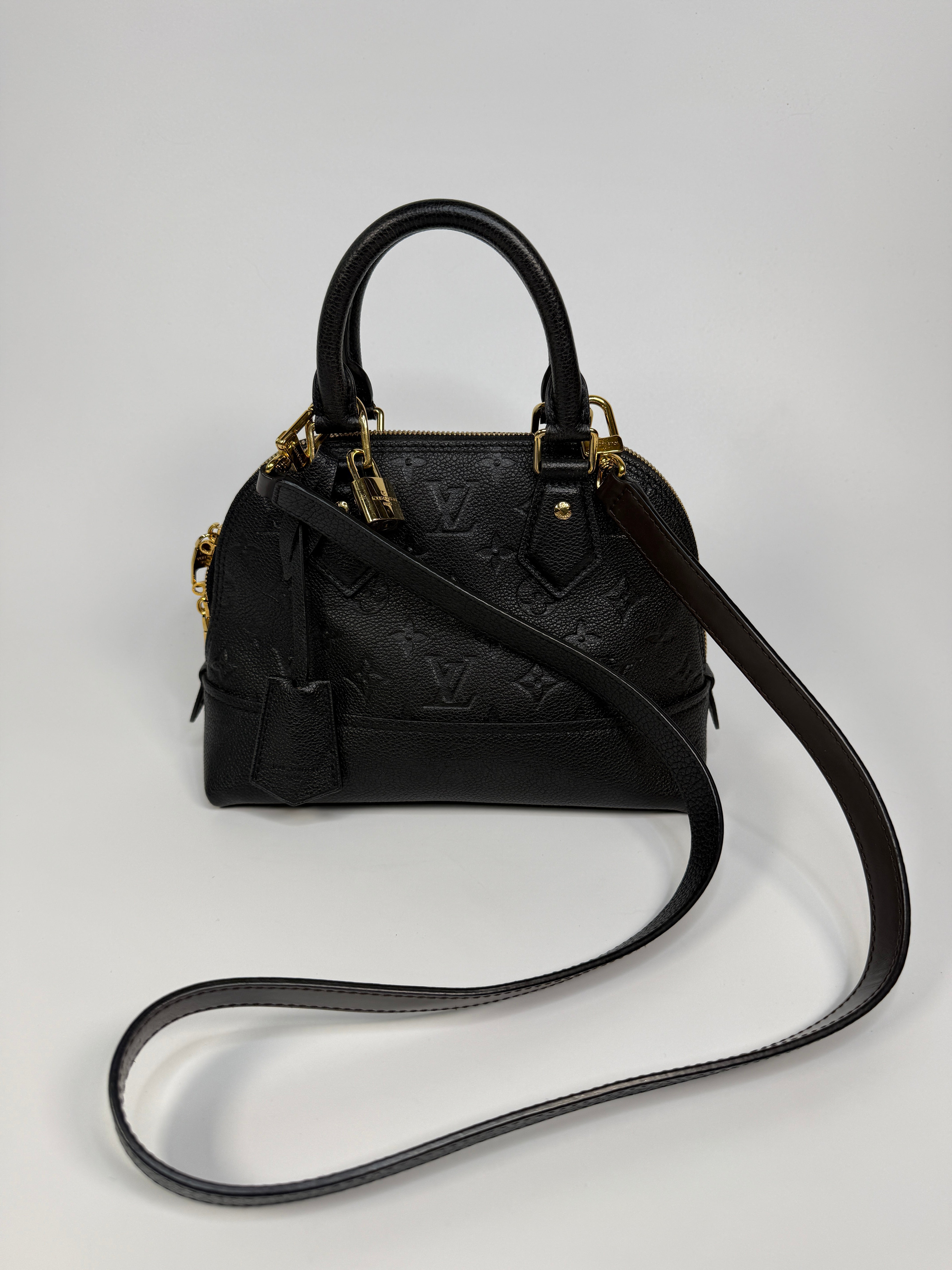 Authentic and preloved Louis Vuitton Alma BB In Empreinte Black Monogram With Gold Hardware