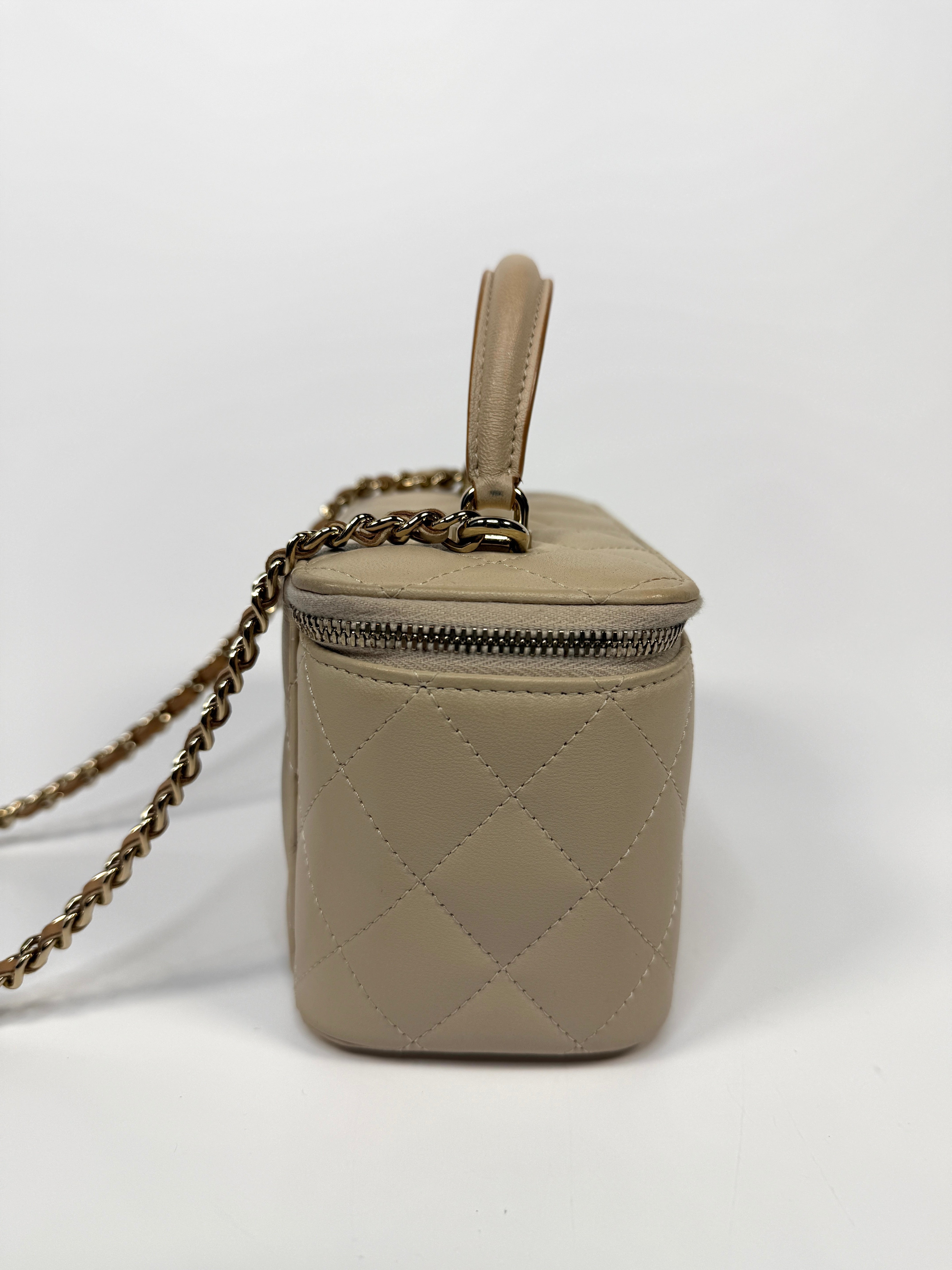 Chanel Vanity Rectangular Top Handle Ecru/Beige Lambskin With Gold Hardware Authentic and preloved. Excellent condition.