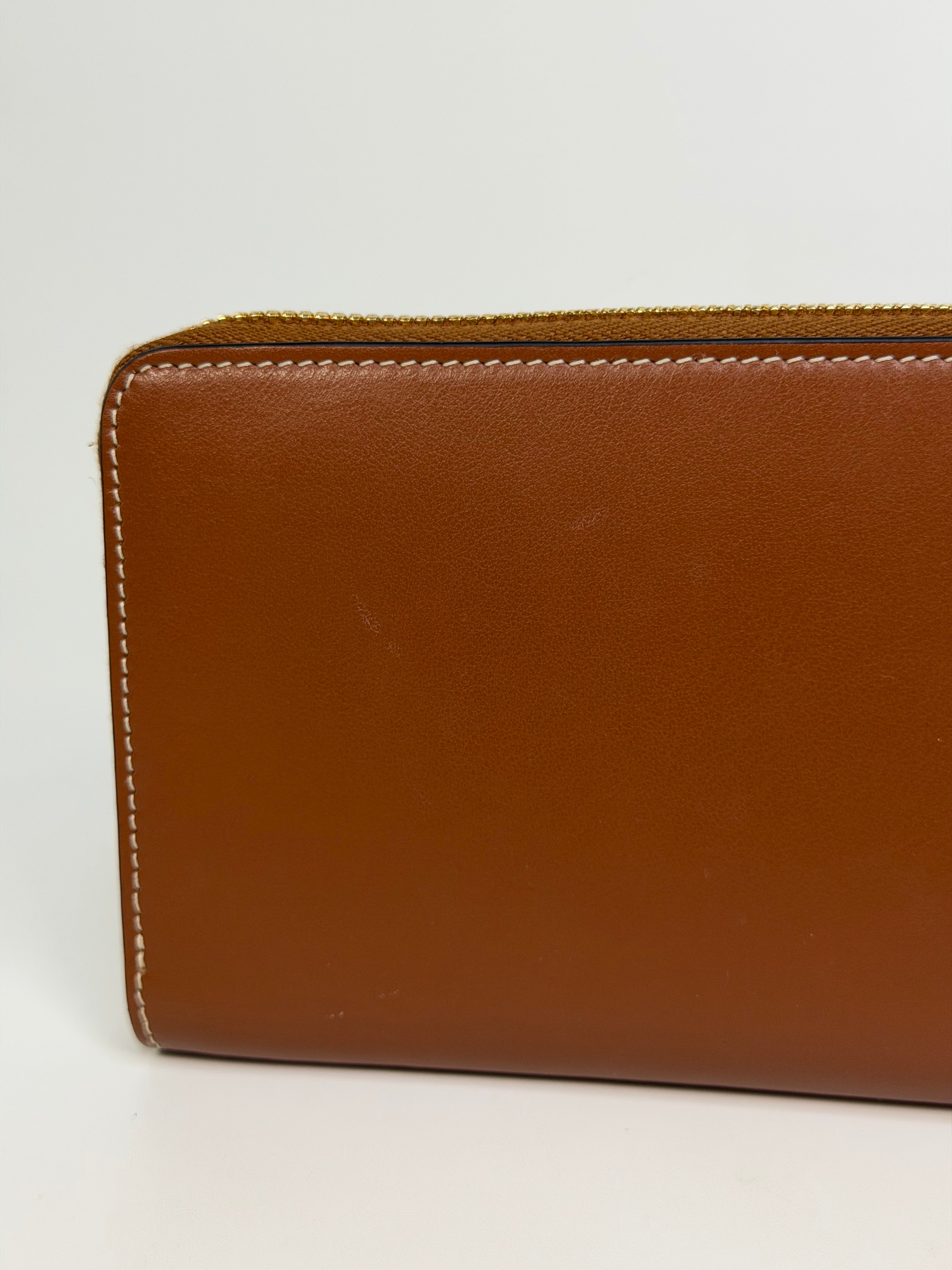 Celine Triomphe Long Wallet In Tan Calfskin With Gold Hardware. Authentic and preloved in excellent condition