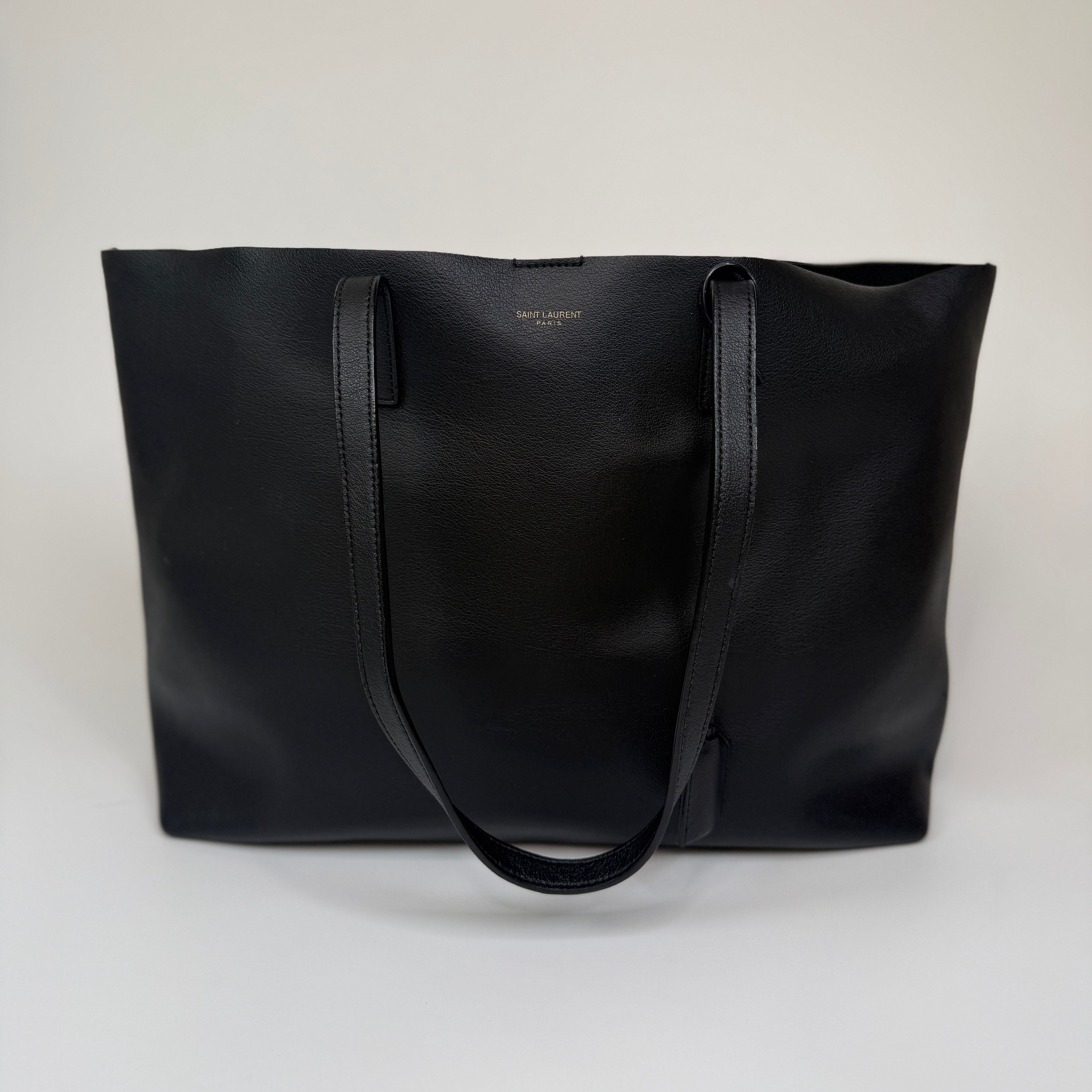 aAuthentic and preloved Saint Laurent Shopping Tote In Black Leather. 100% Authenticity guarantee