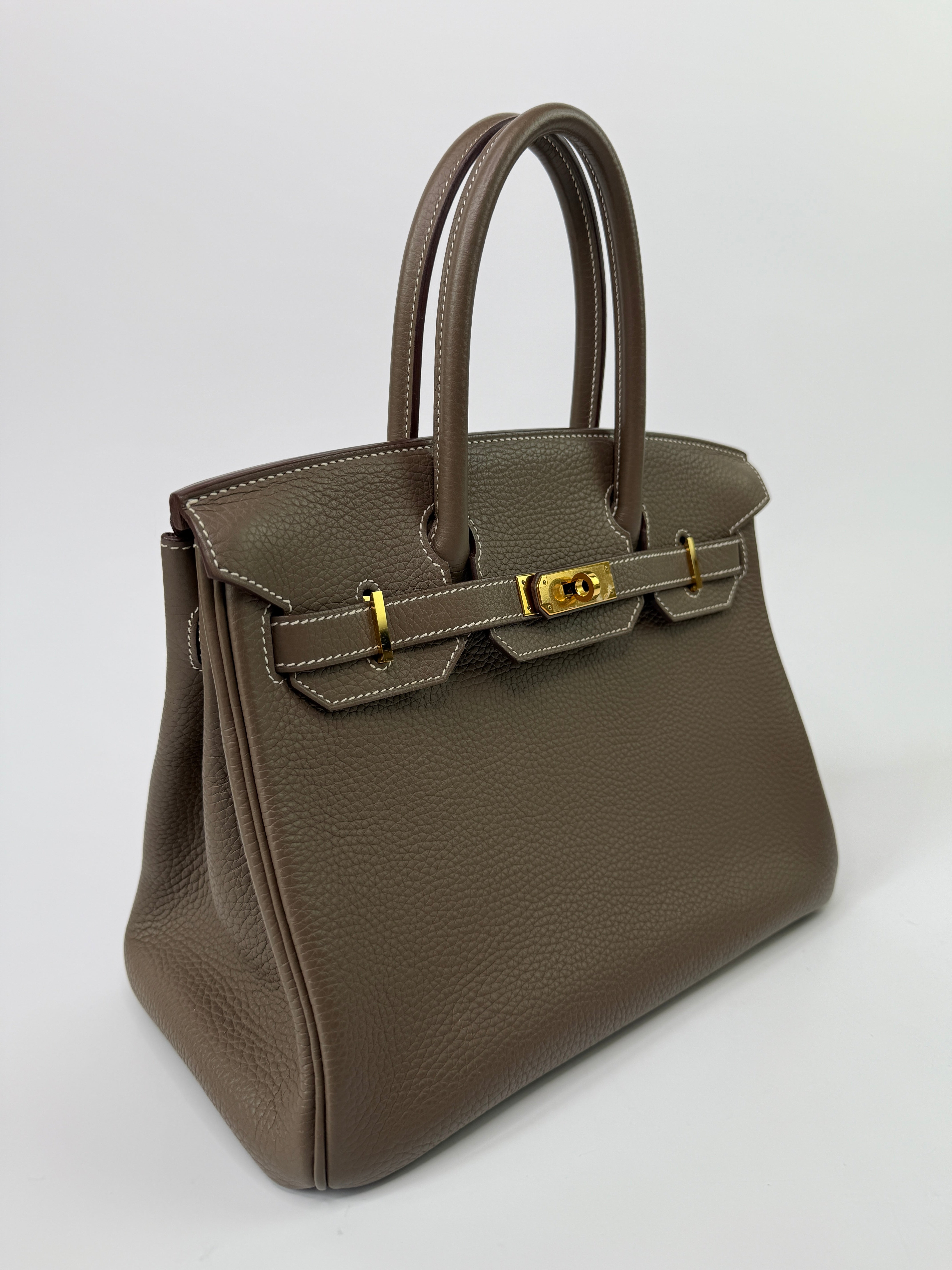 Authentic pre-loved Hermès Birkin 30 In Etoupe Togo Leather With Gold Hardware.