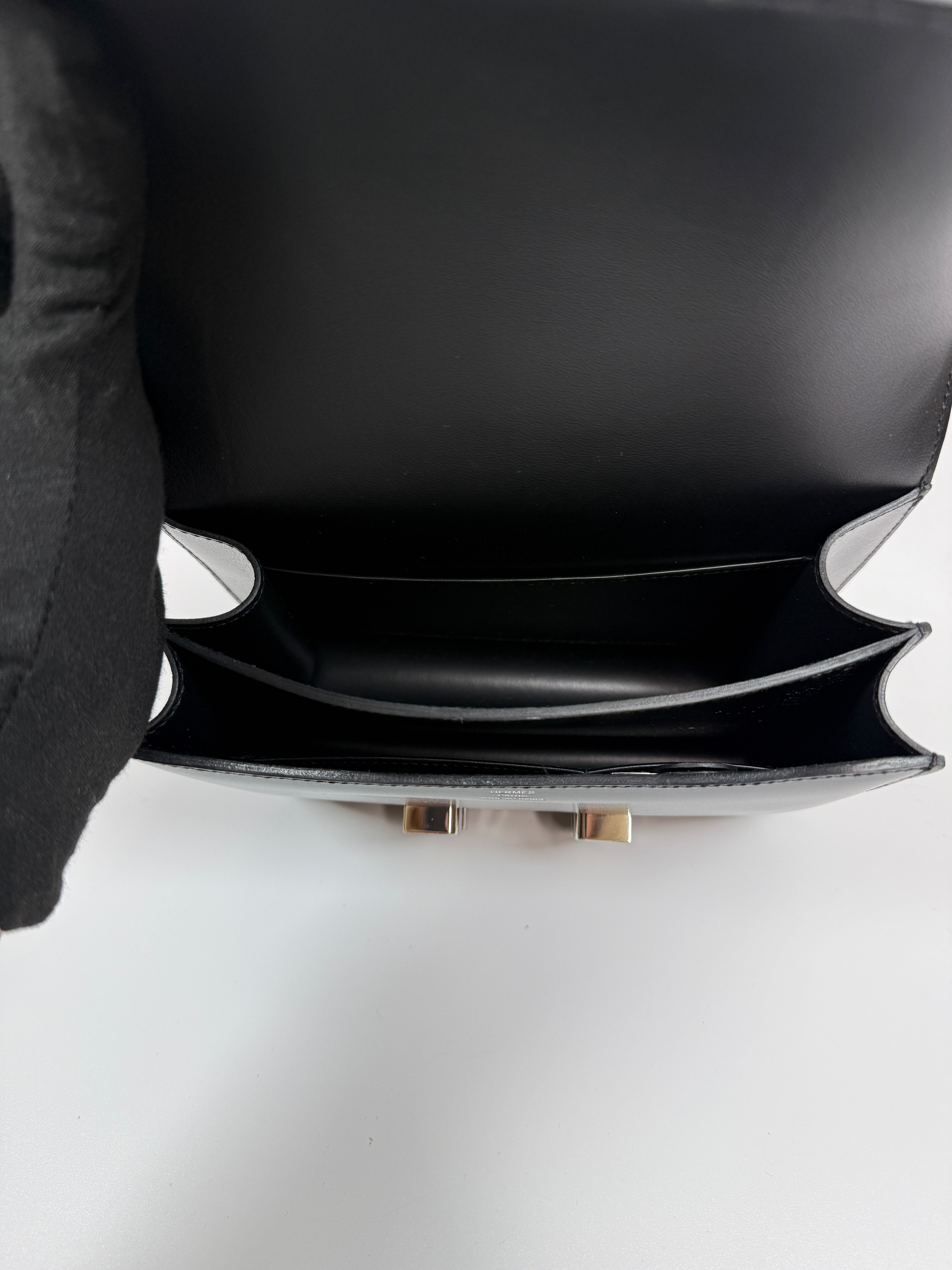 Authentic and preloved Hermès Constance 18 In Black Box Leather With Palladium Hardware. 100% Authenticity guarantee.