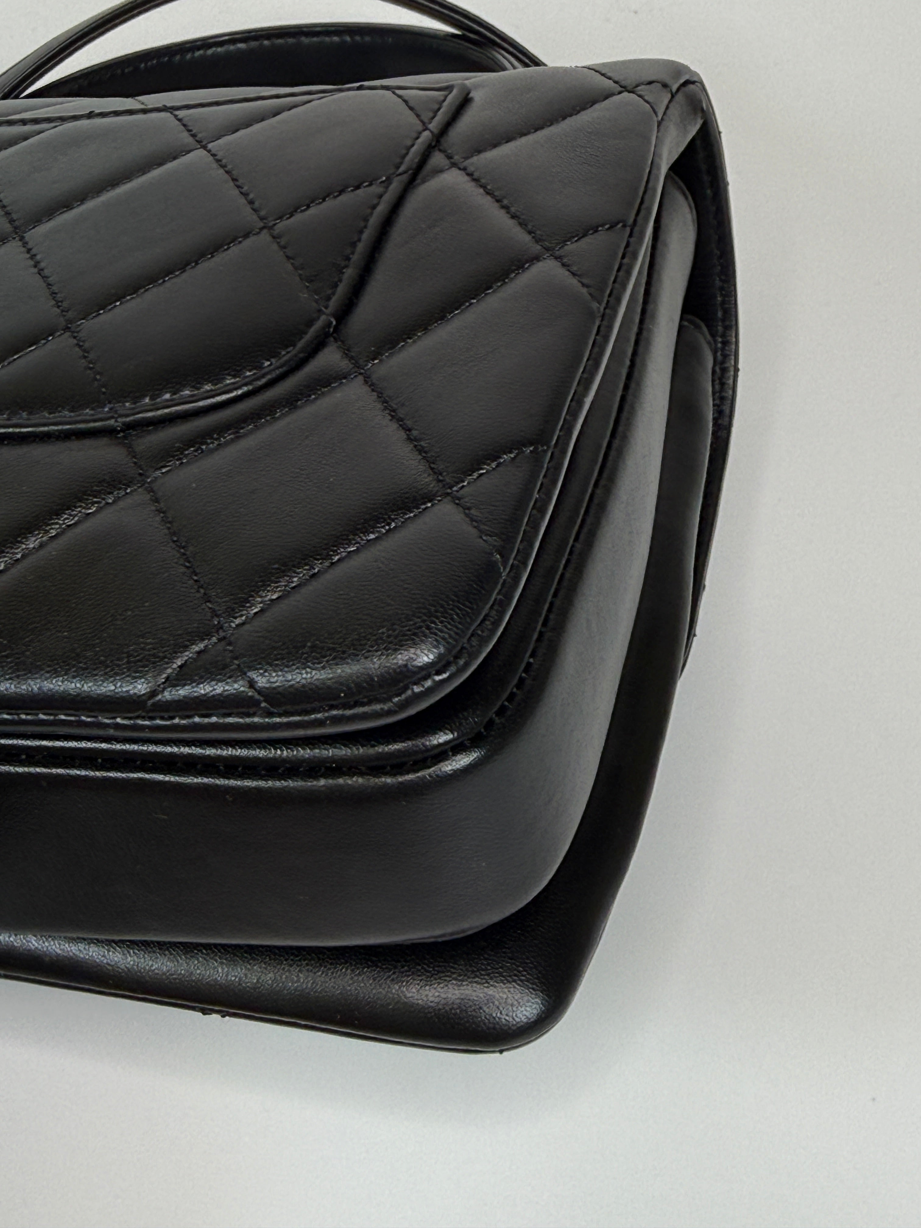 Authentic and preloved Chanel Trendy Top Handle Flap Bag In Black Lambskin With Gold Hardware. Excellent condition. 100% Authenticity guarantee