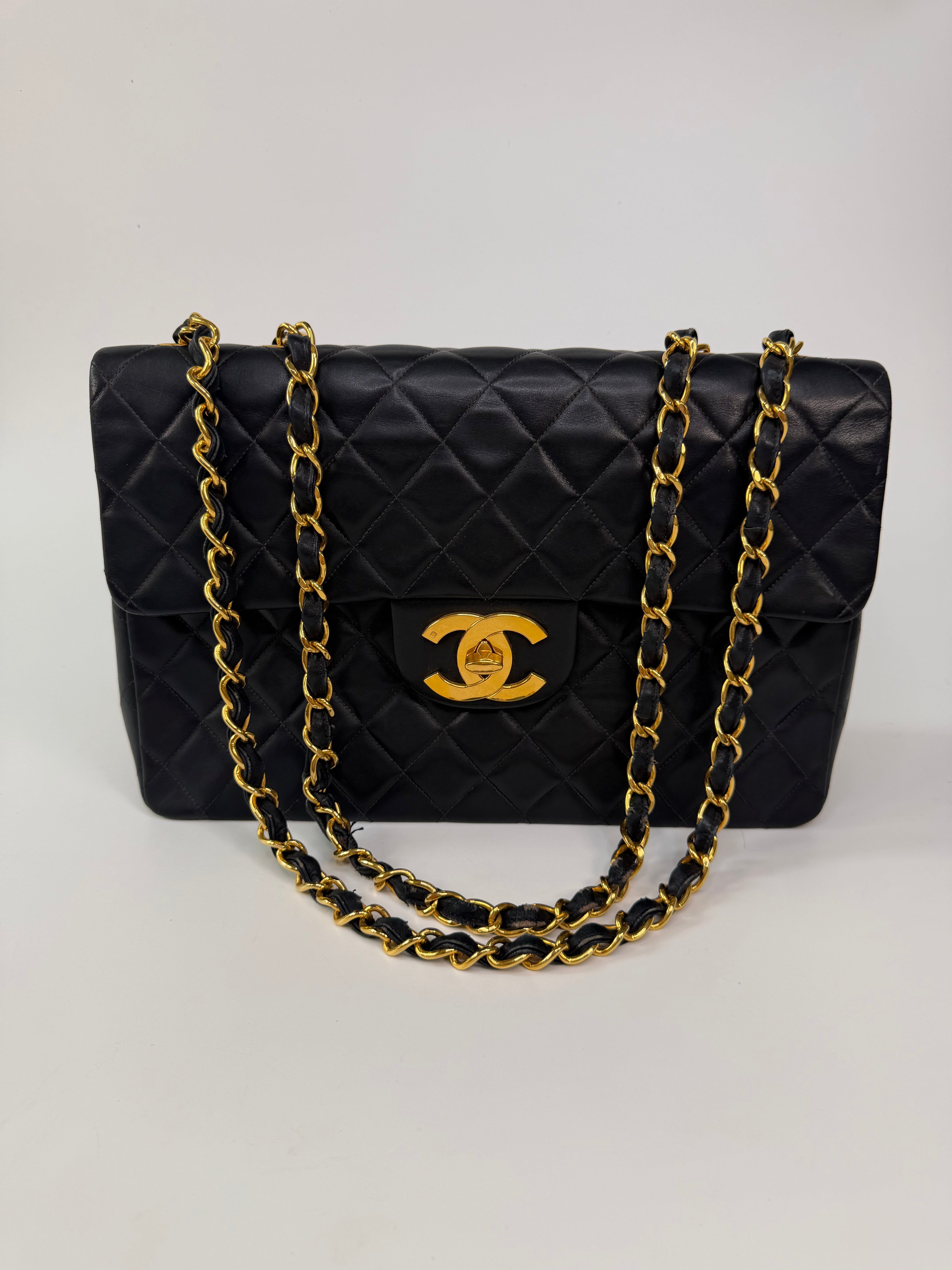 Chanel Vintage XL Maxi Flap Bag In Black Lambskin Gold Hardware. 100% authentic and preloved in excellent condition