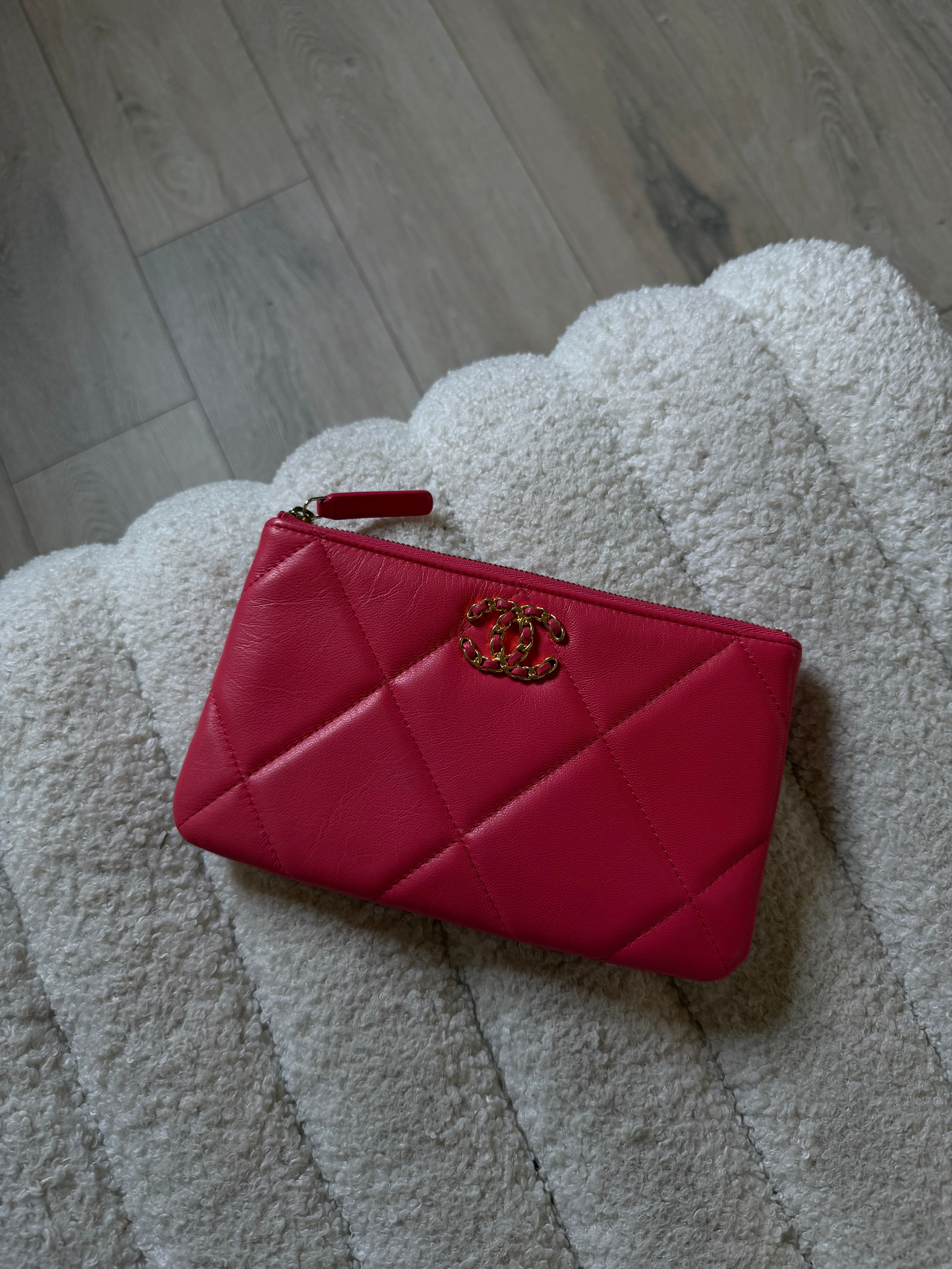 Chanel 19 Zip Pouch In Pink Calfskin Leather With Gold Hardware. Authentic preloved condition.