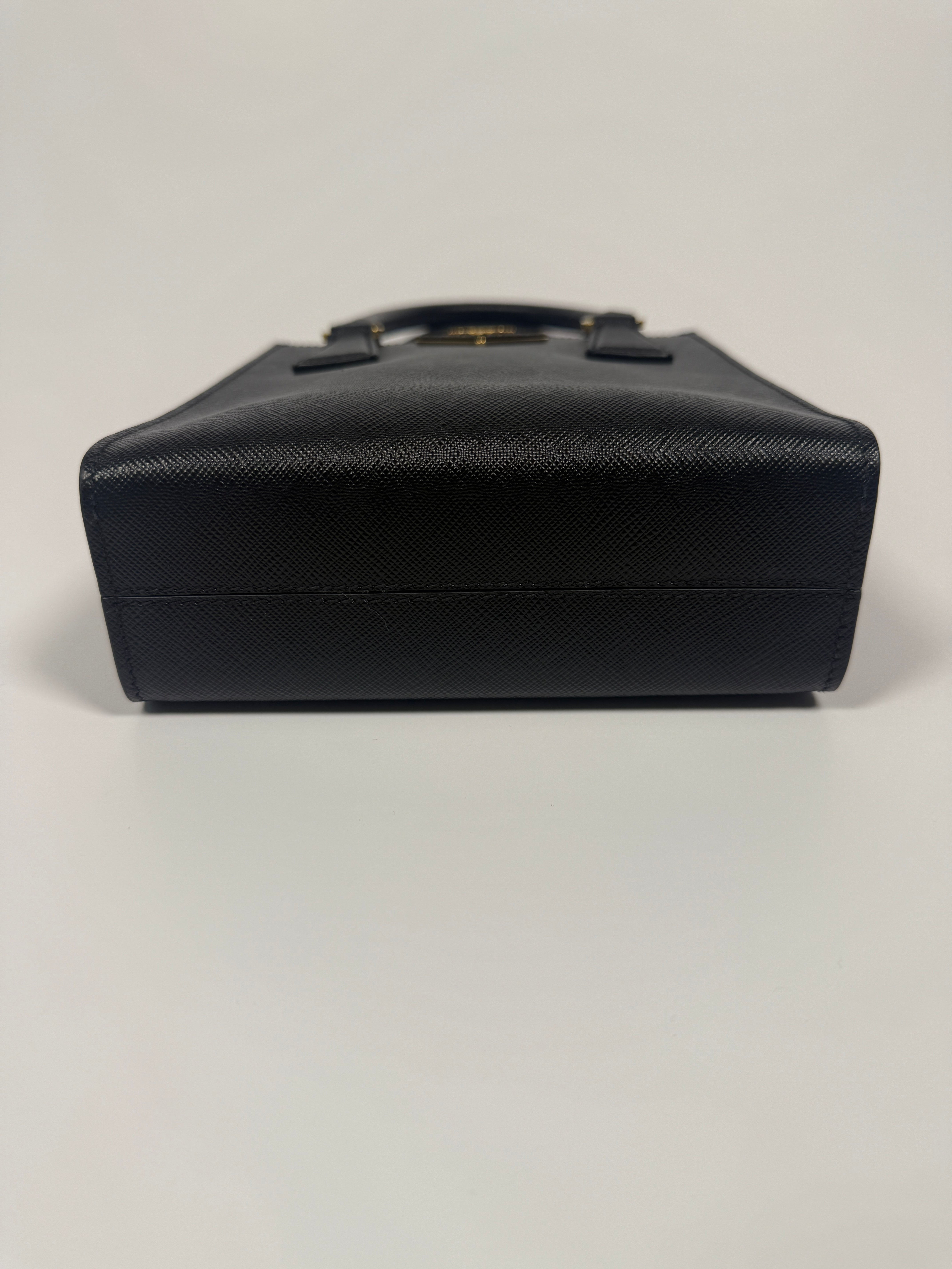 Prada Mini Tote In Black Saffiano Leather With Gold Hardware. 100% Authentic and preloved in excellent condition