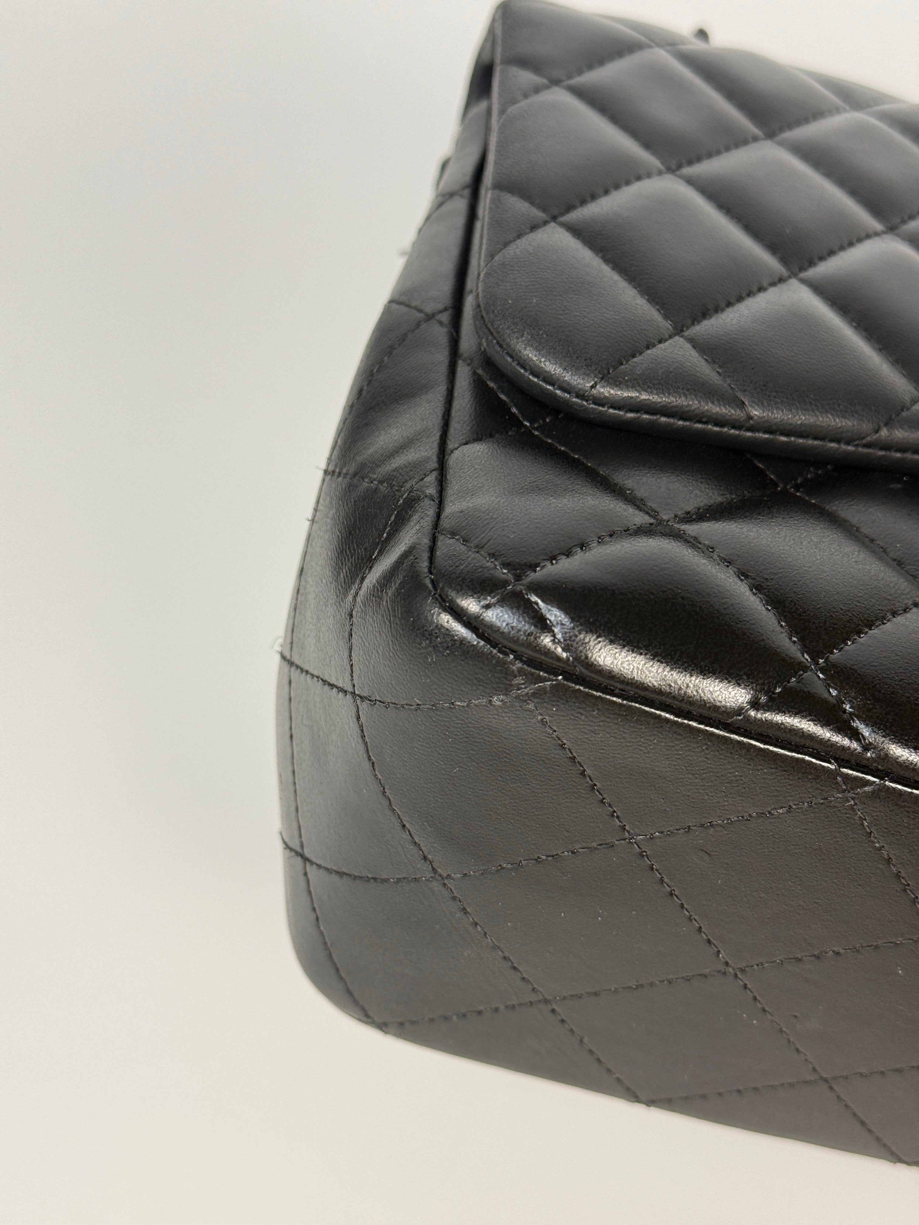 Authentic and preloved Chanel Jumbo Classic Flap Bag In Black Lambskin Leather With Silver hardware. Very Good condition. 100% Authenticity guarantee