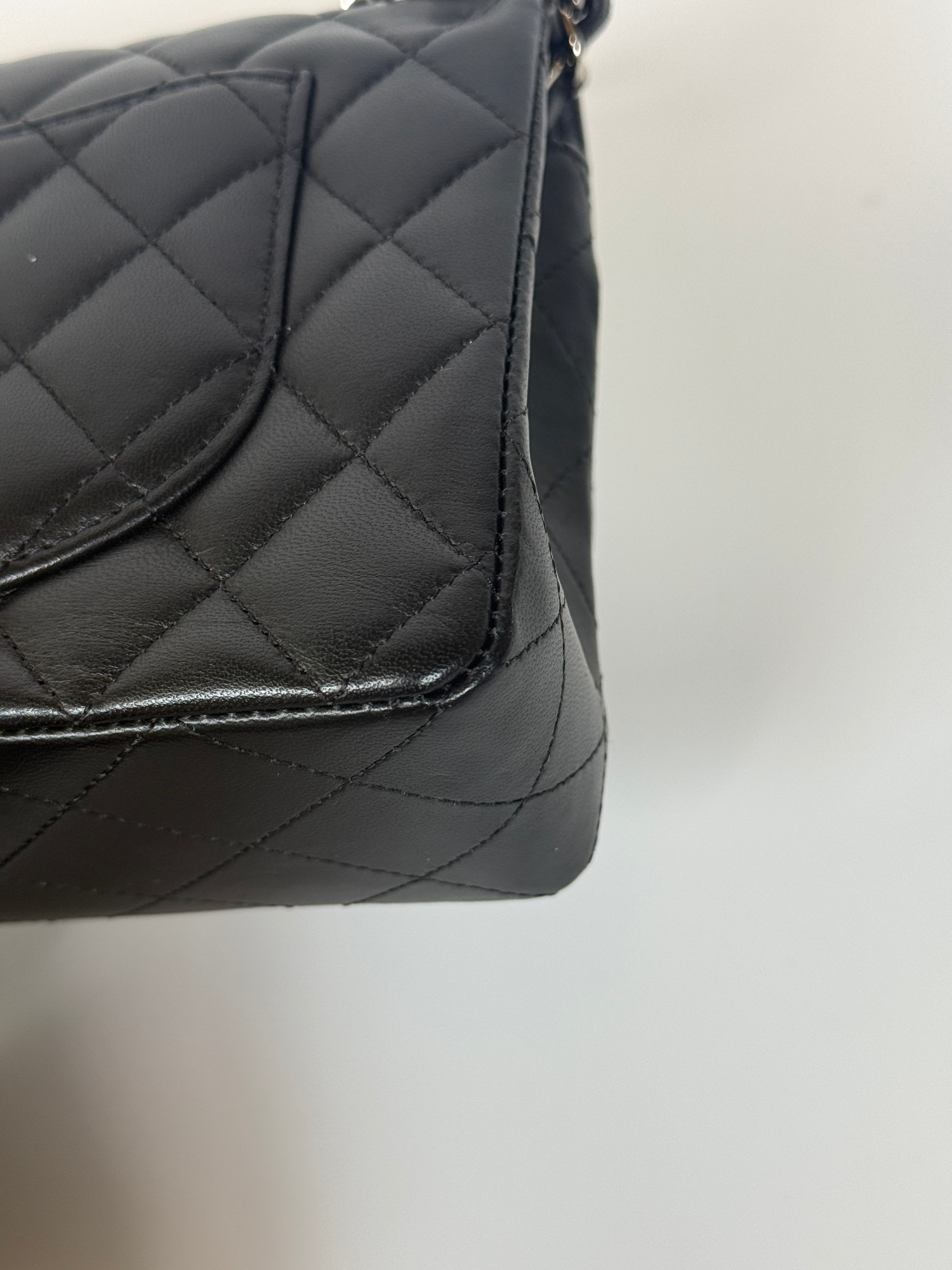 Authentic and preloved Chanel Small Classic Double Flap In Black Lambskin Leather With Silver hardware 100% Authenticity guarantee
