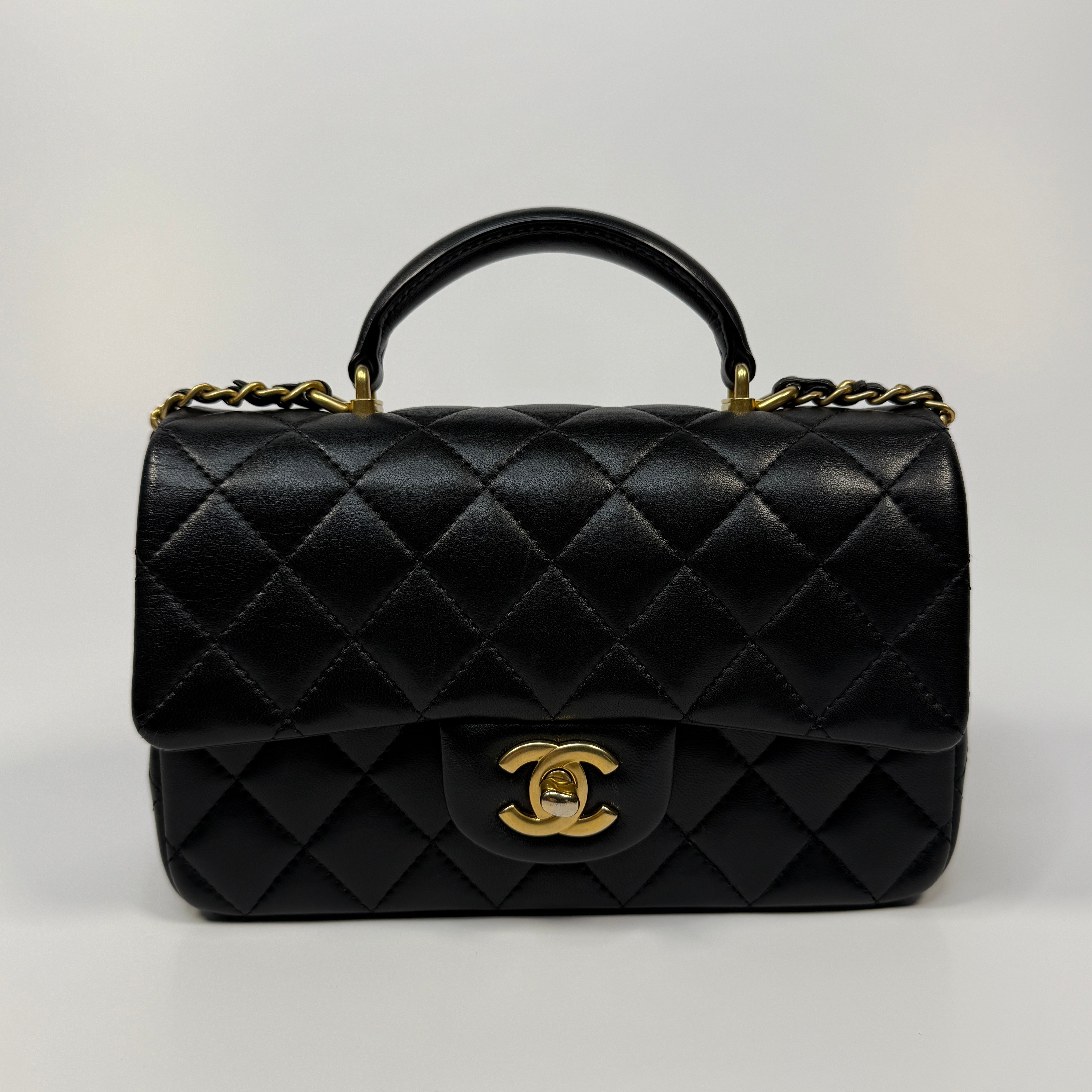 Chanel Mini Rectangle Top Handle Flap Bag In Black Lambskin With Gold Hardware
Pre Loved & Authentic