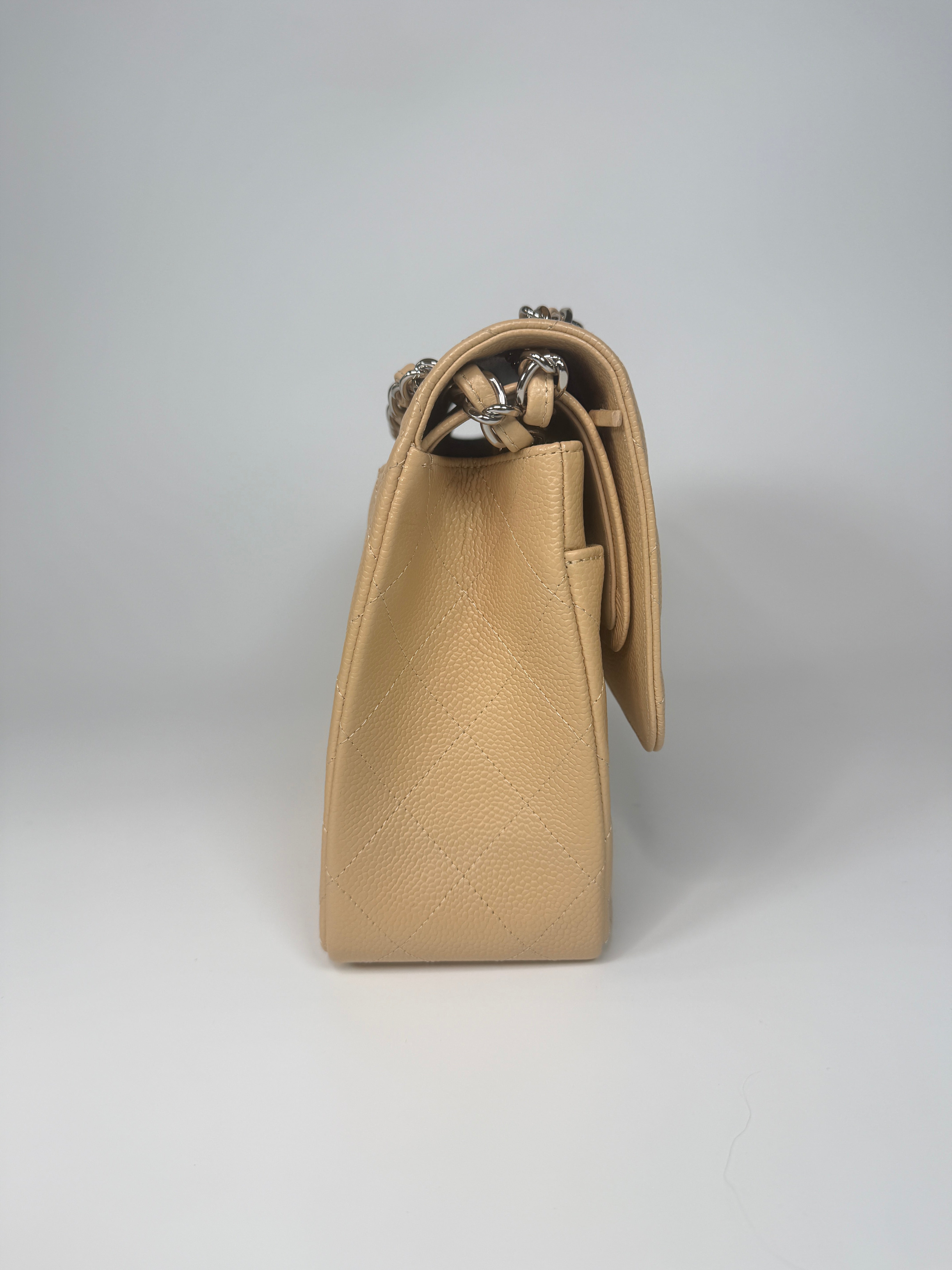 Authentic and preloved Chanel Jumbo Classic Flap Bag In Beige Caviar Leather With Silver Hardware. 100% Authenticity guarantee. Verified by Luxe Cheshire. Fully Insured next day delivery