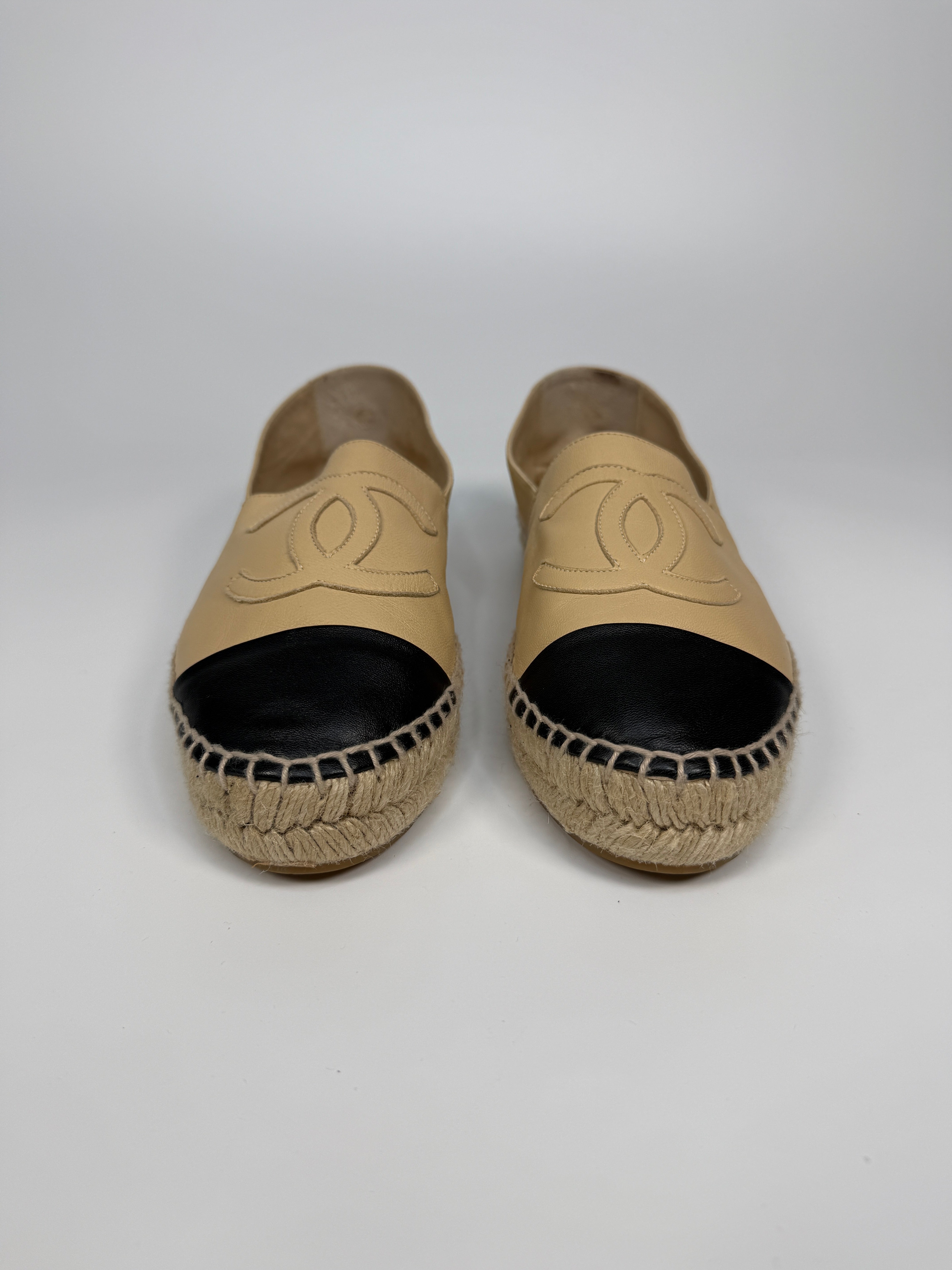 Authentic and preloved Chanel Espadrilles (Size 38/UK5) In Beige and Black Lambskin Leather. Excellent condition. 100% Authenticity guarantee