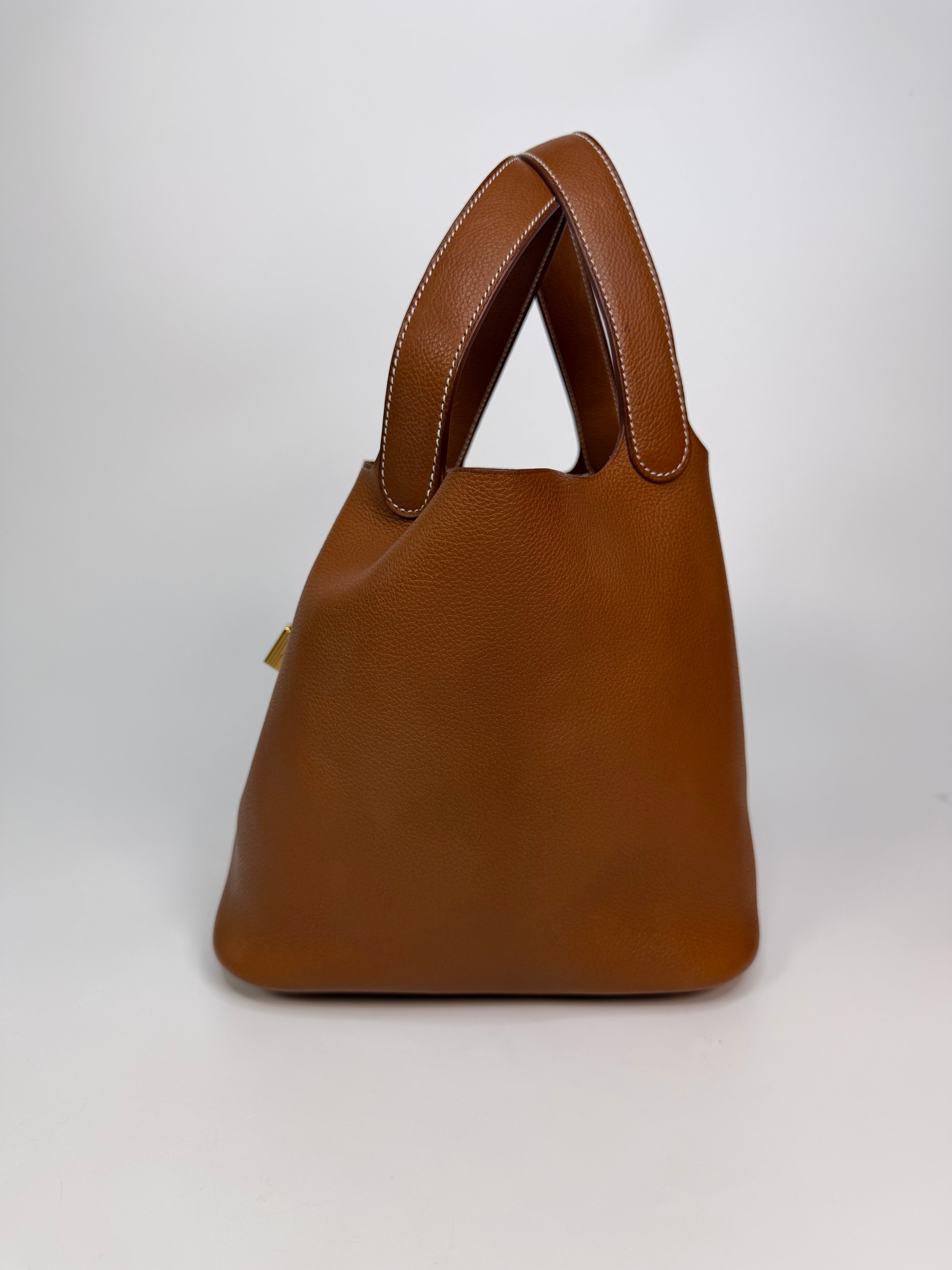 Hermès Picotin 22 In Gold Barenia Fauboug Leather With Gold Hardware. Authentic and preloved in excellent condition