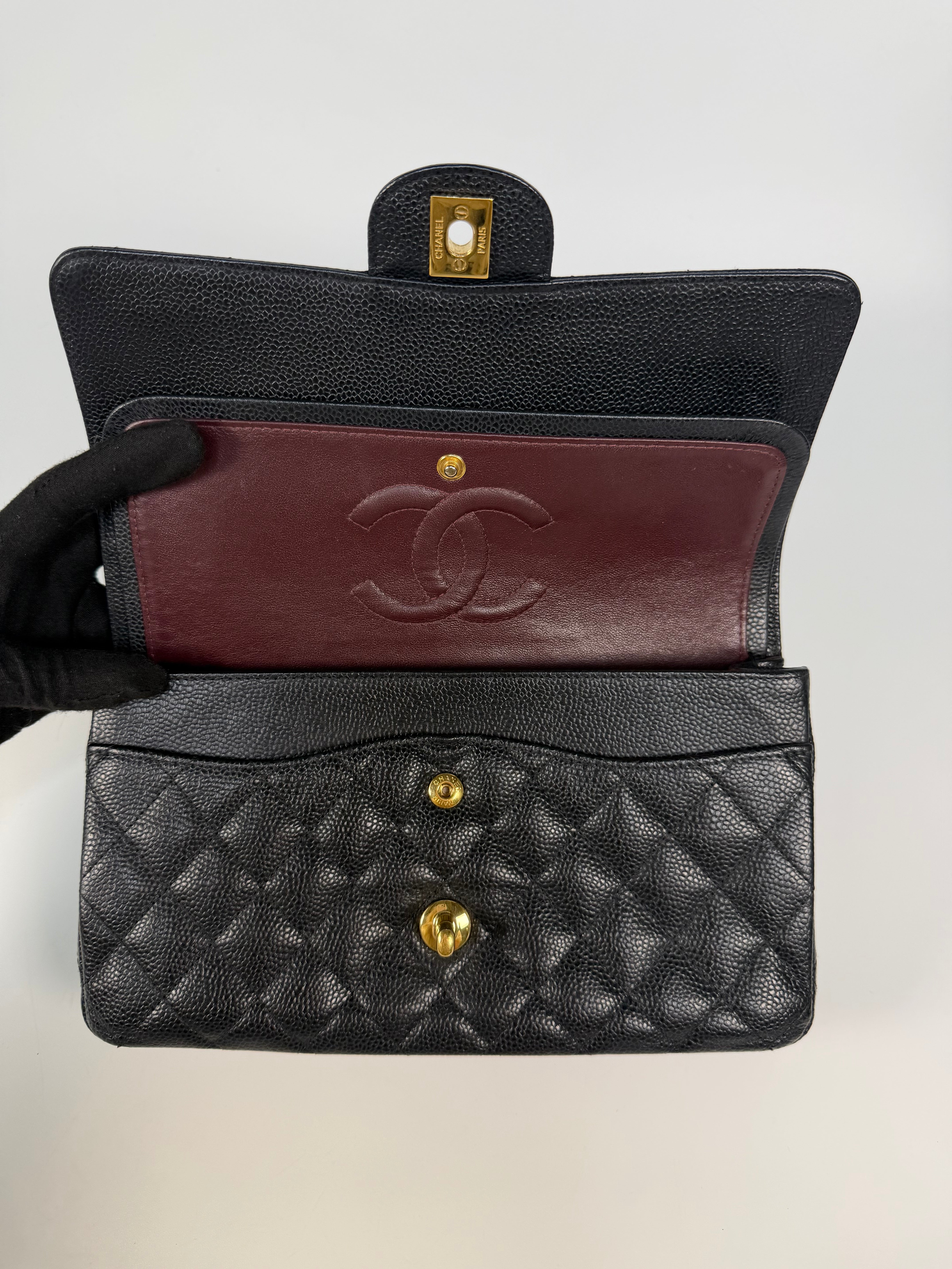 Chanel Medium Classic Double Flap In Black Caviar Leather Gold Hardware. 100% authentic and preloved in excellent condition