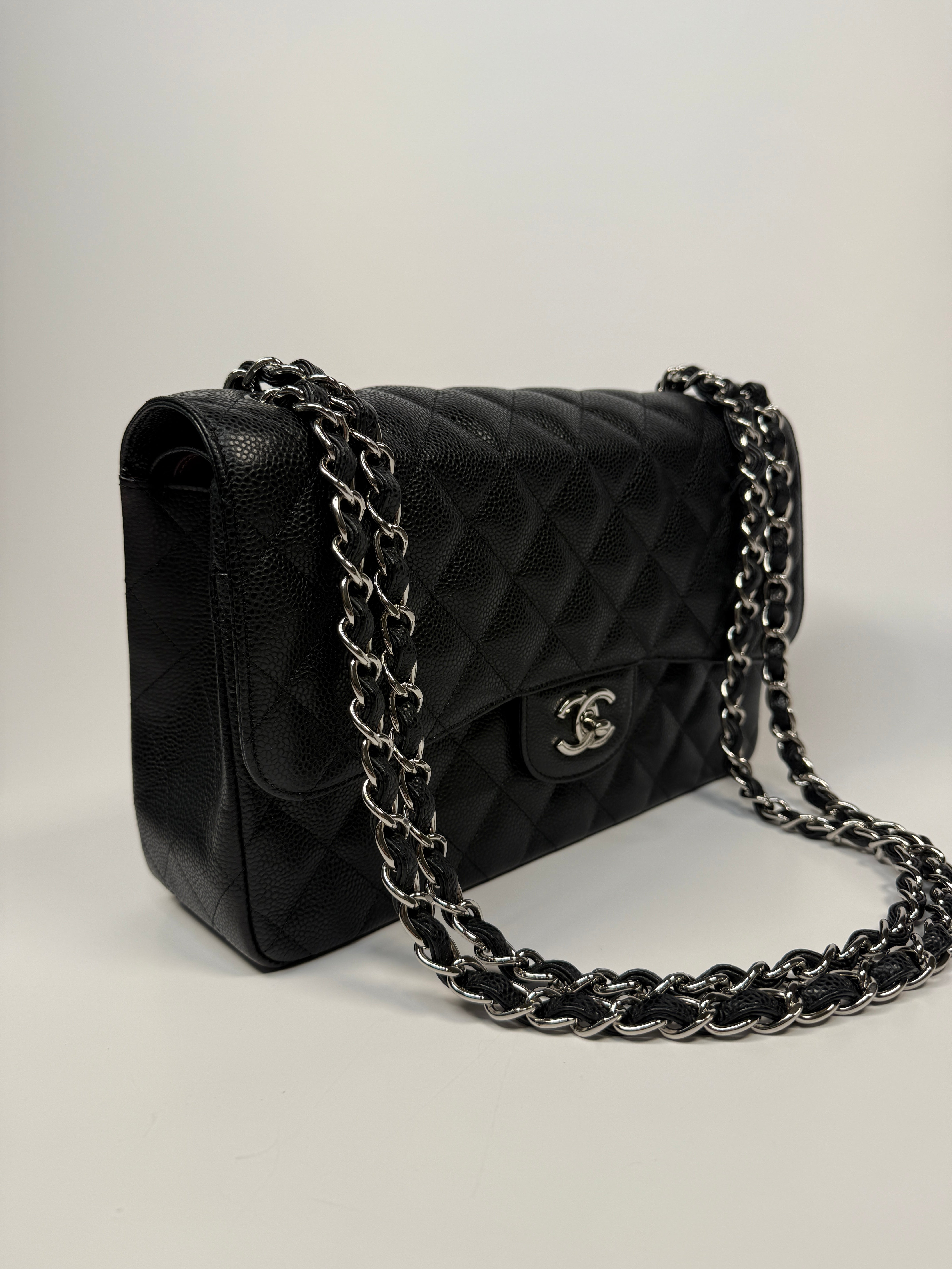 Chanel Classic Jumbo Flap Bag In Black Caviar Leather With Silver Hardware. Authentic and preloved. Excellent condition.