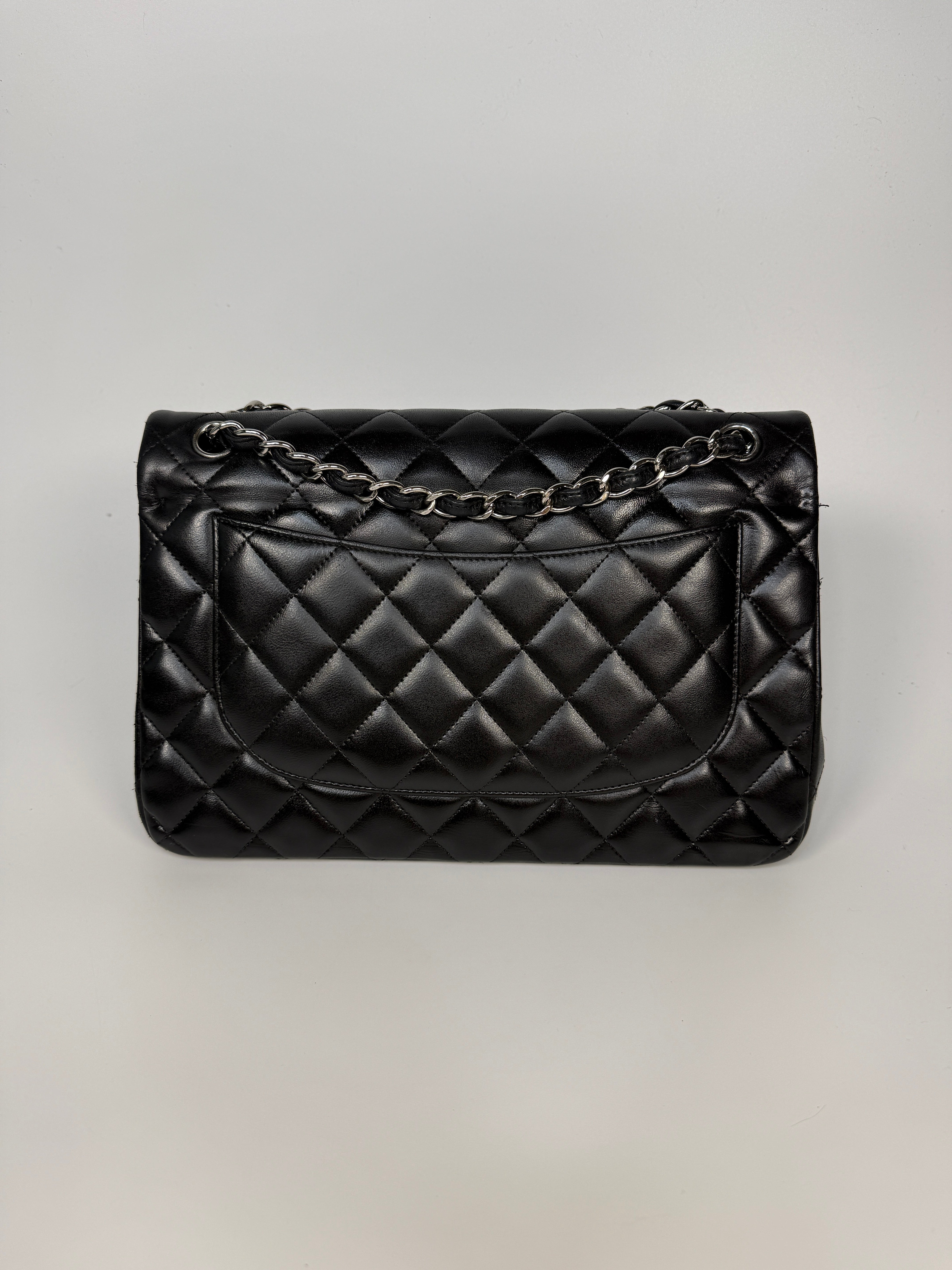 Authentic and preloved Chanel Jumbo Classic Flap Bag In Black Lambskin Leather With Silver hardware. Very Good condition. 100% Authenticity guarantee