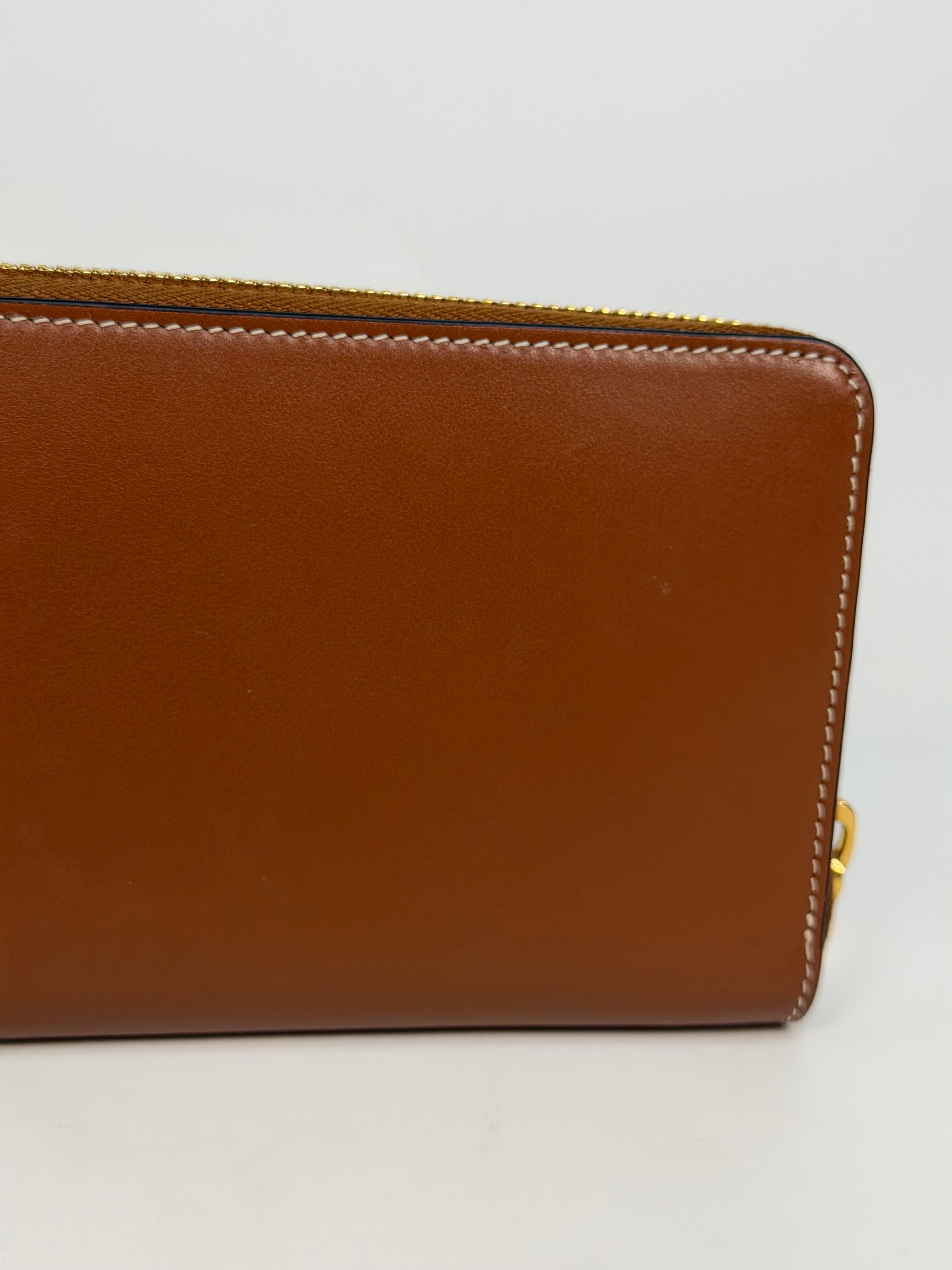 Celine Triomphe Long Wallet In Tan Calfskin With Gold Hardware. Authentic and preloved in excellent condition