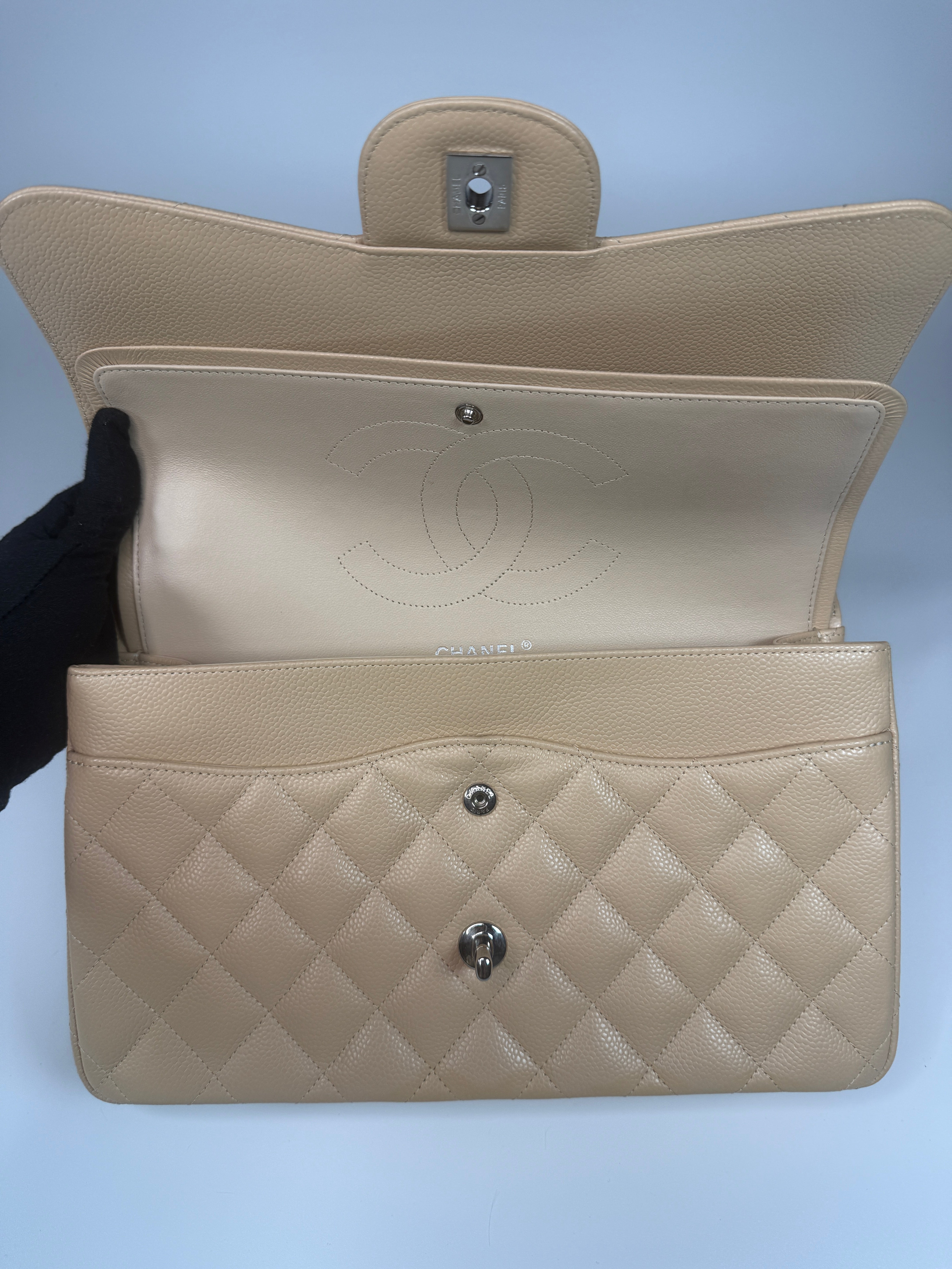Authentic and preloved Chanel Jumbo Classic Flap Bag In Beige Caviar Leather With Silver Hardware. 100% Authenticity guarantee. Verified by Luxe Cheshire. Fully Insured next day delivery