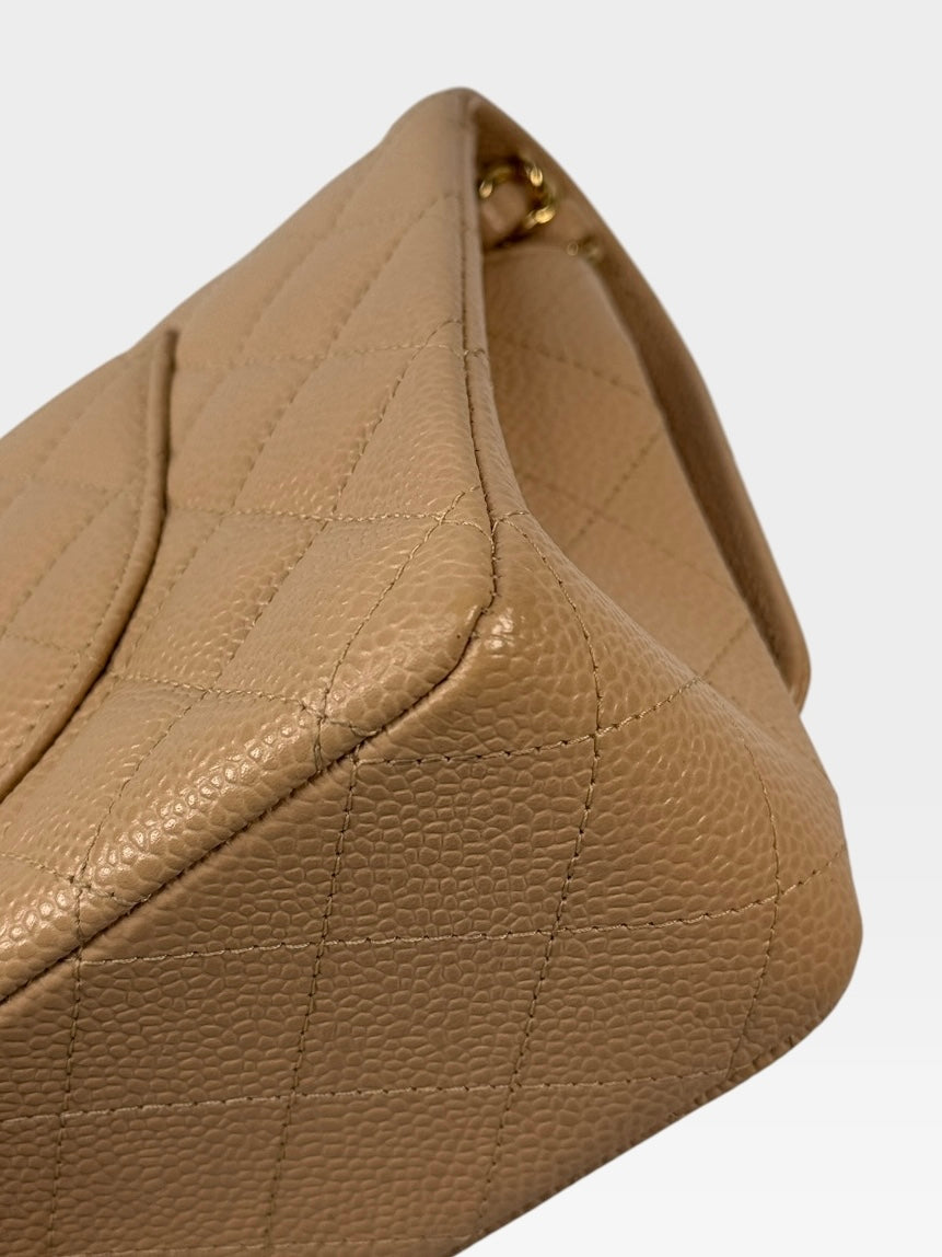 Chanel Medium Classic Flap In Beige Caviar Leather With Gold Hardware. 100% authentic and preloved in excellent condition