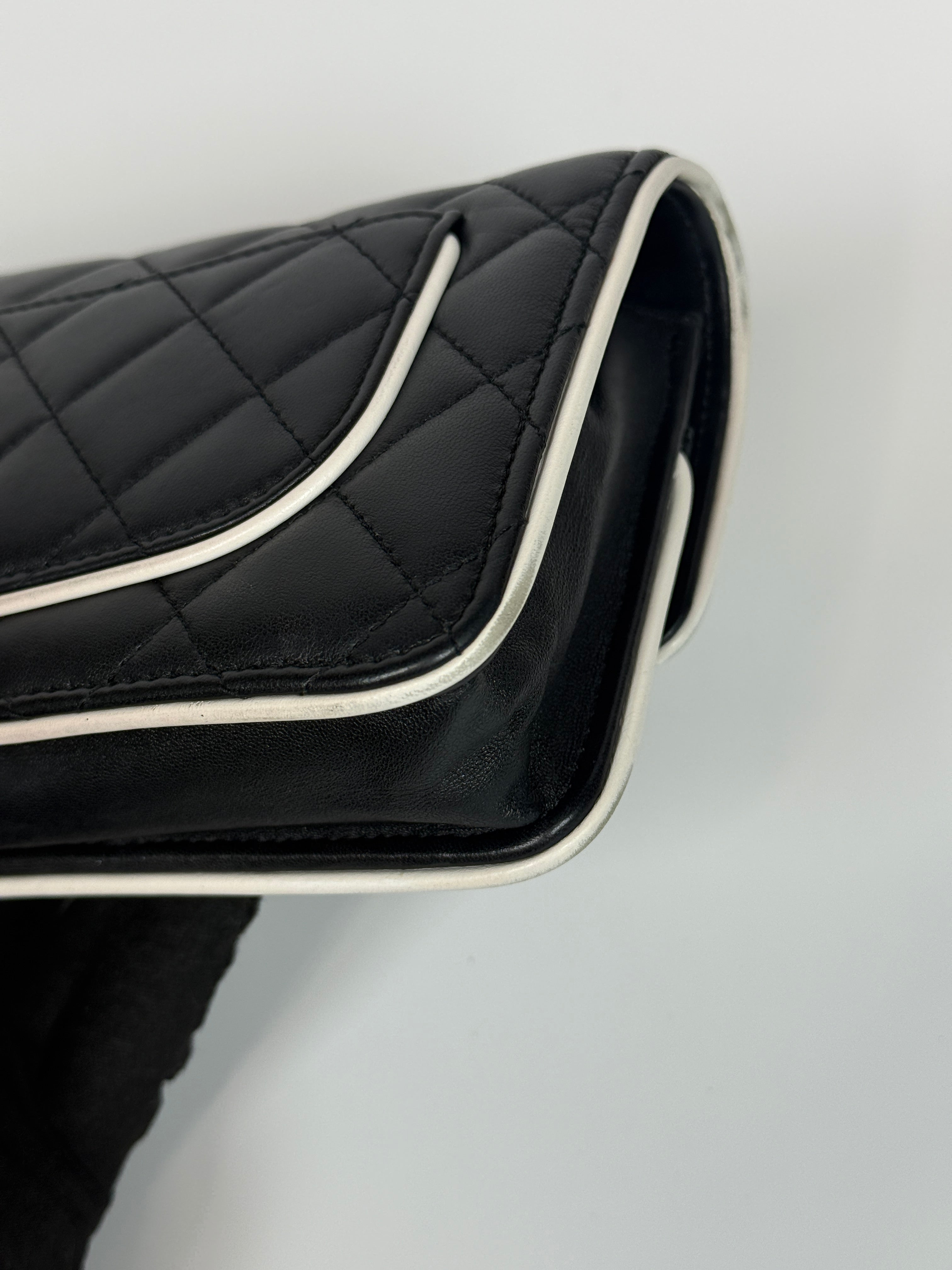 Authentic and preloved Chanel Wallet On Chain In Black & White Lambskin Leather With Pale Gold Hardware. Very Good Condition. 100% Authenticity Guarantee