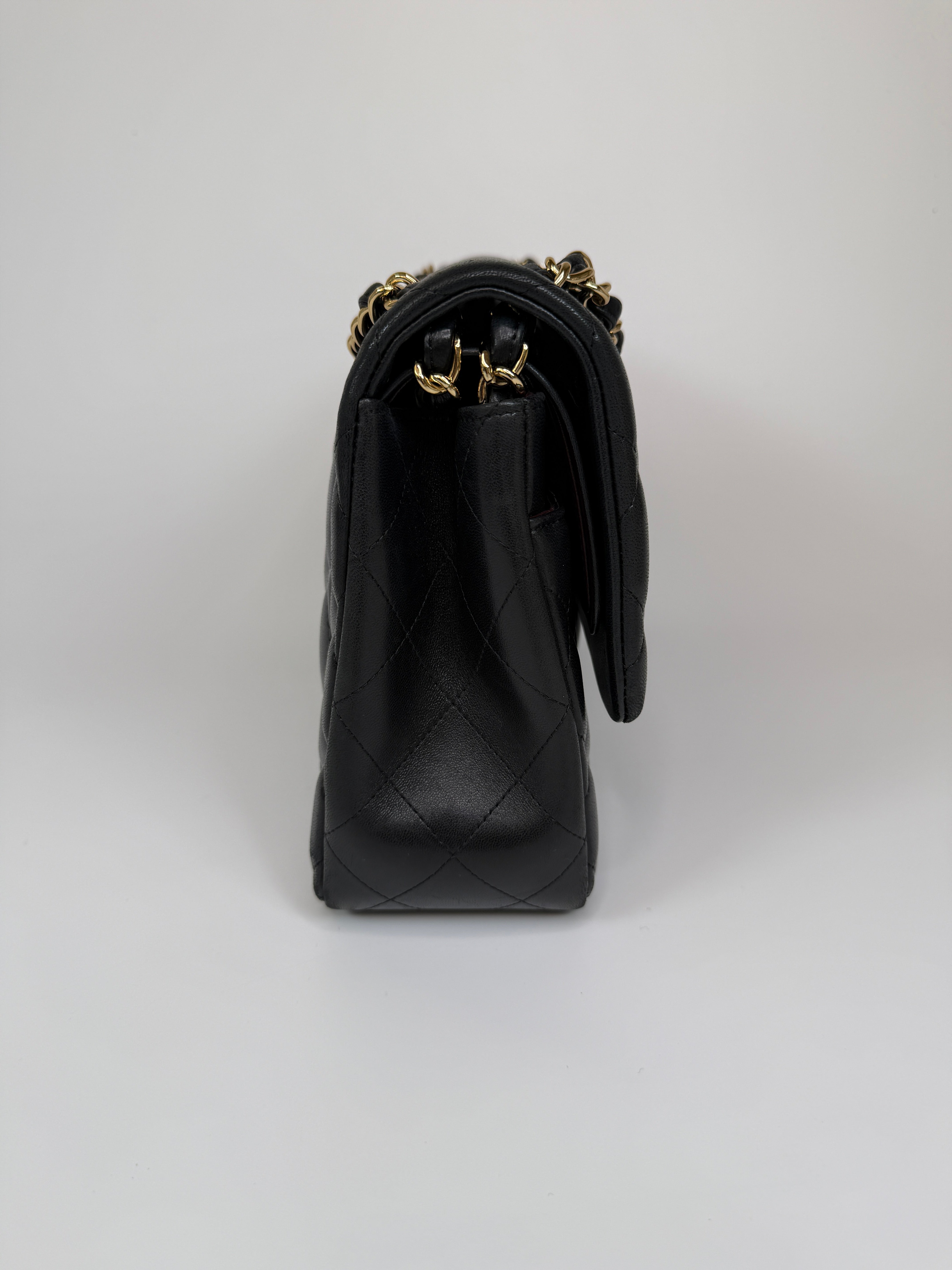 Authentic and preloved Chanel Jumbo Classic Flap Bag In Black Lambskin Leather With GOLD Hardware. Excellent condition. 100% Authenticity Guarantee