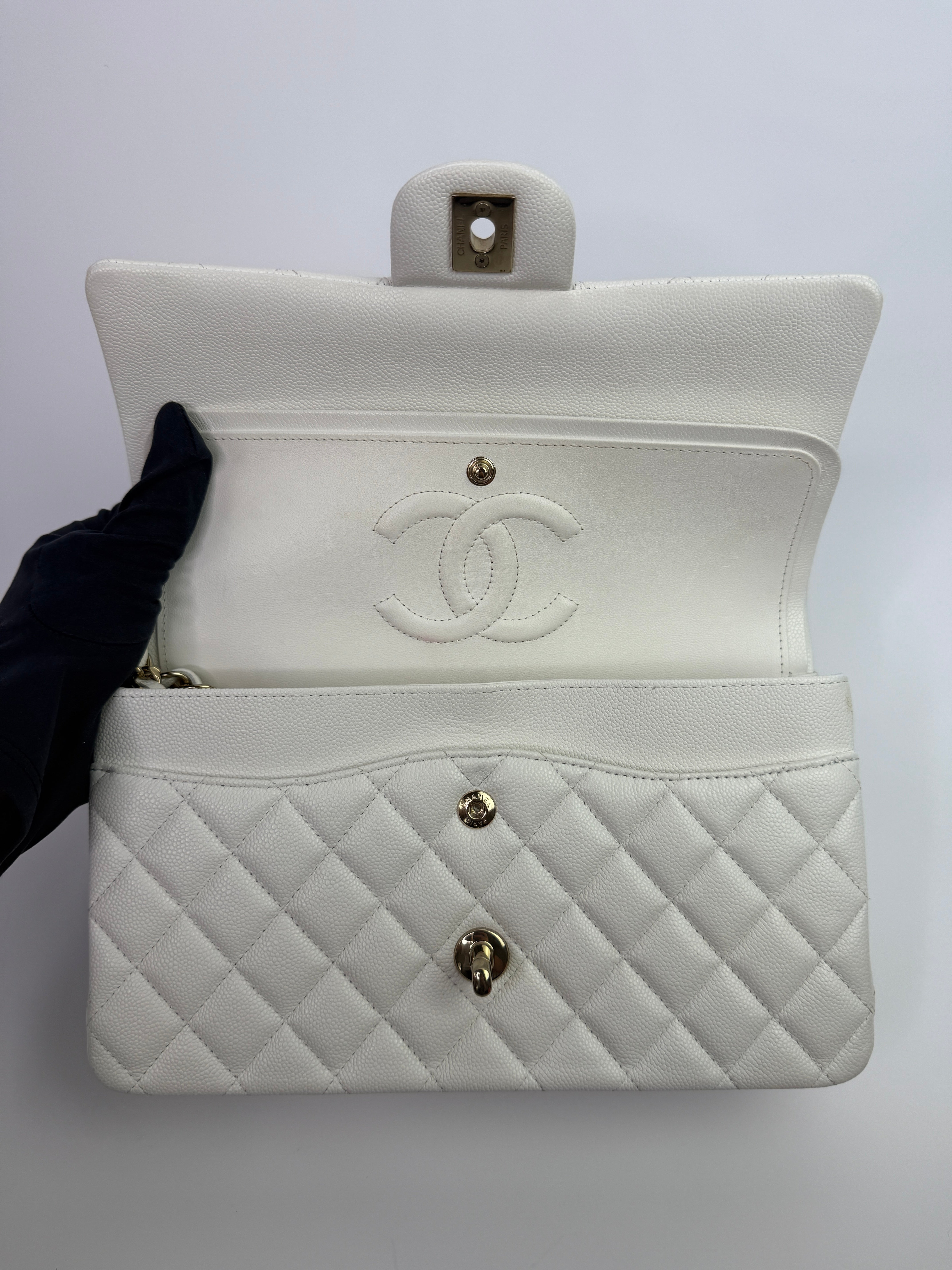 Authentic pre-loved Chanel Medium Classic Double Flap White Caviar Leather With Gold Hardware.