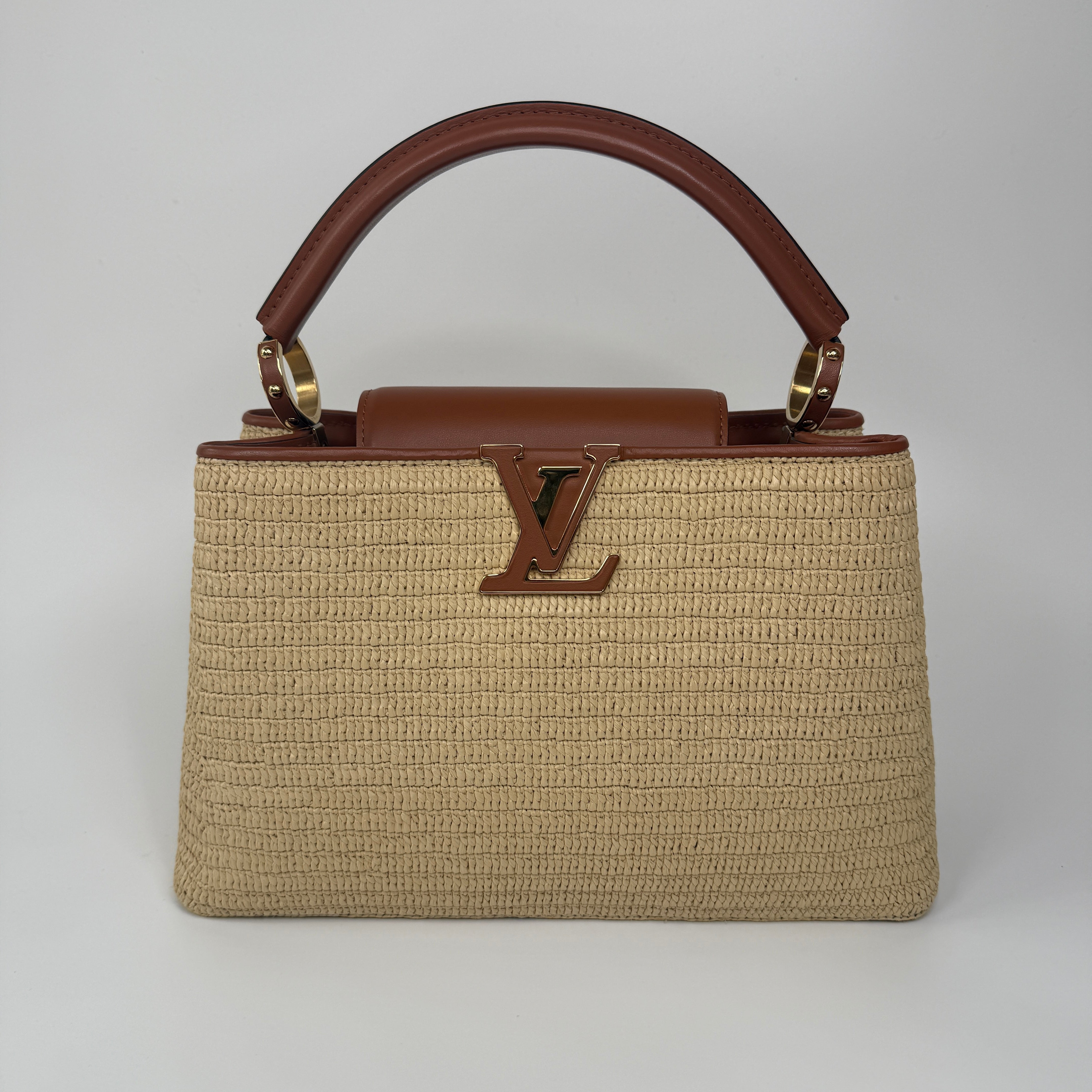 Louis Vuitton Capucines MM Bag In Raffia. Excellent Preloved condition. 100% Authenticity guarantee.