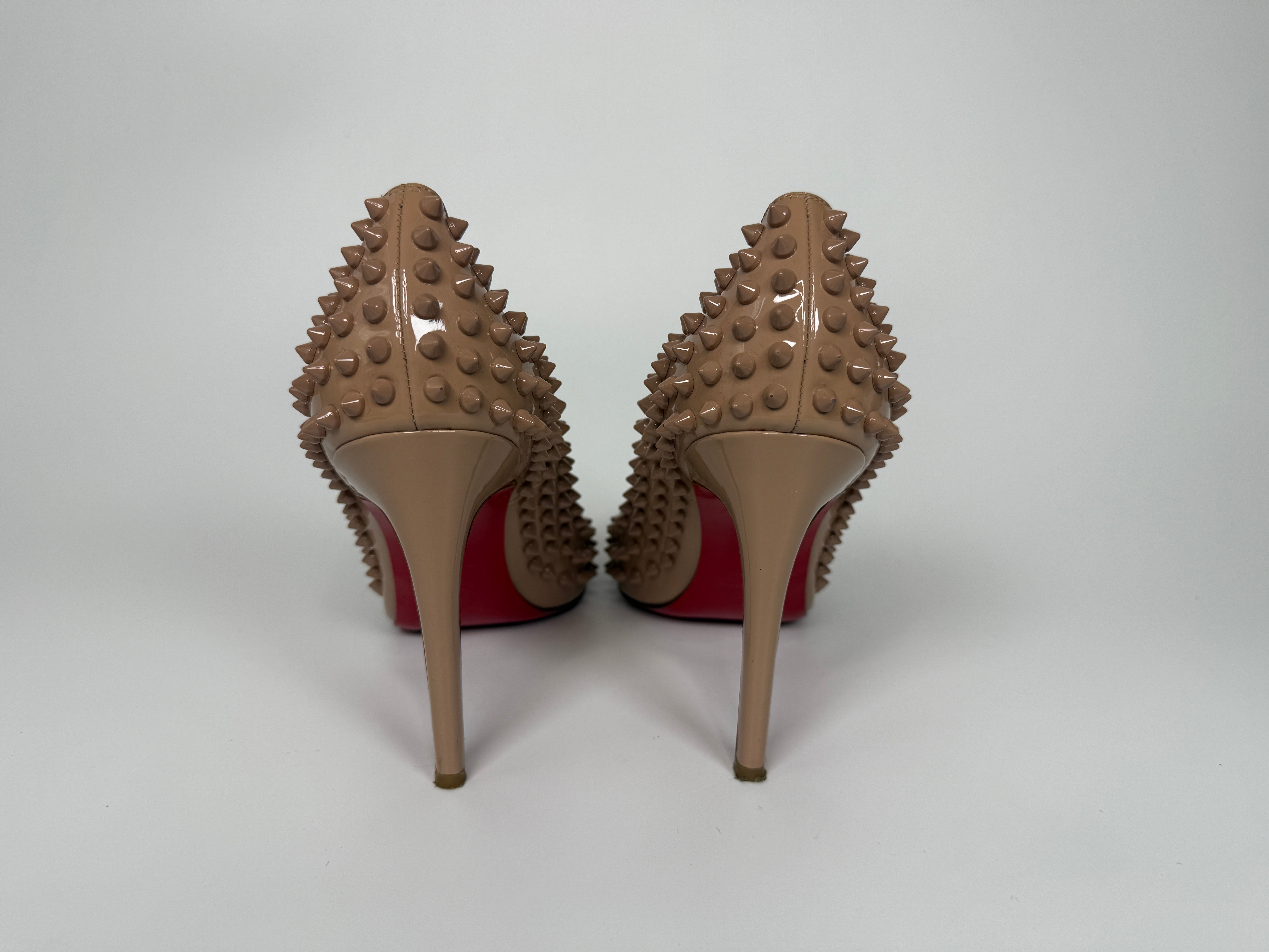 Authentic and preloved Christian Louboutin Nude Spike Pigalle 100 Heels (Size 41.5/UK8.5) Very Good condition. 100% Authenticity Guarantee