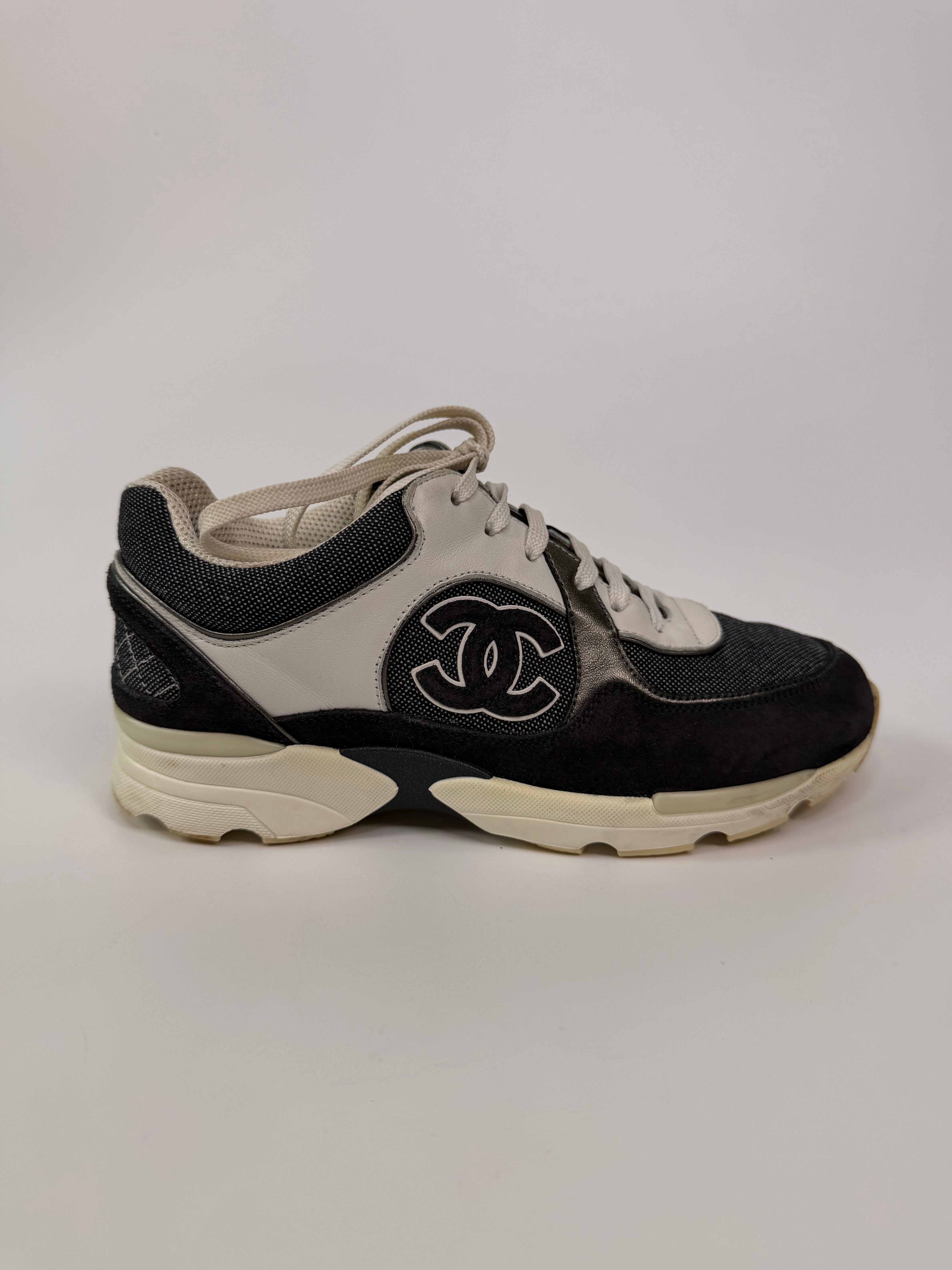 Chanel CC Sneakers In Dark Grey, White & Silver (Size 36.5/UK3.5). 100% authentic and preloved in excellent condition.