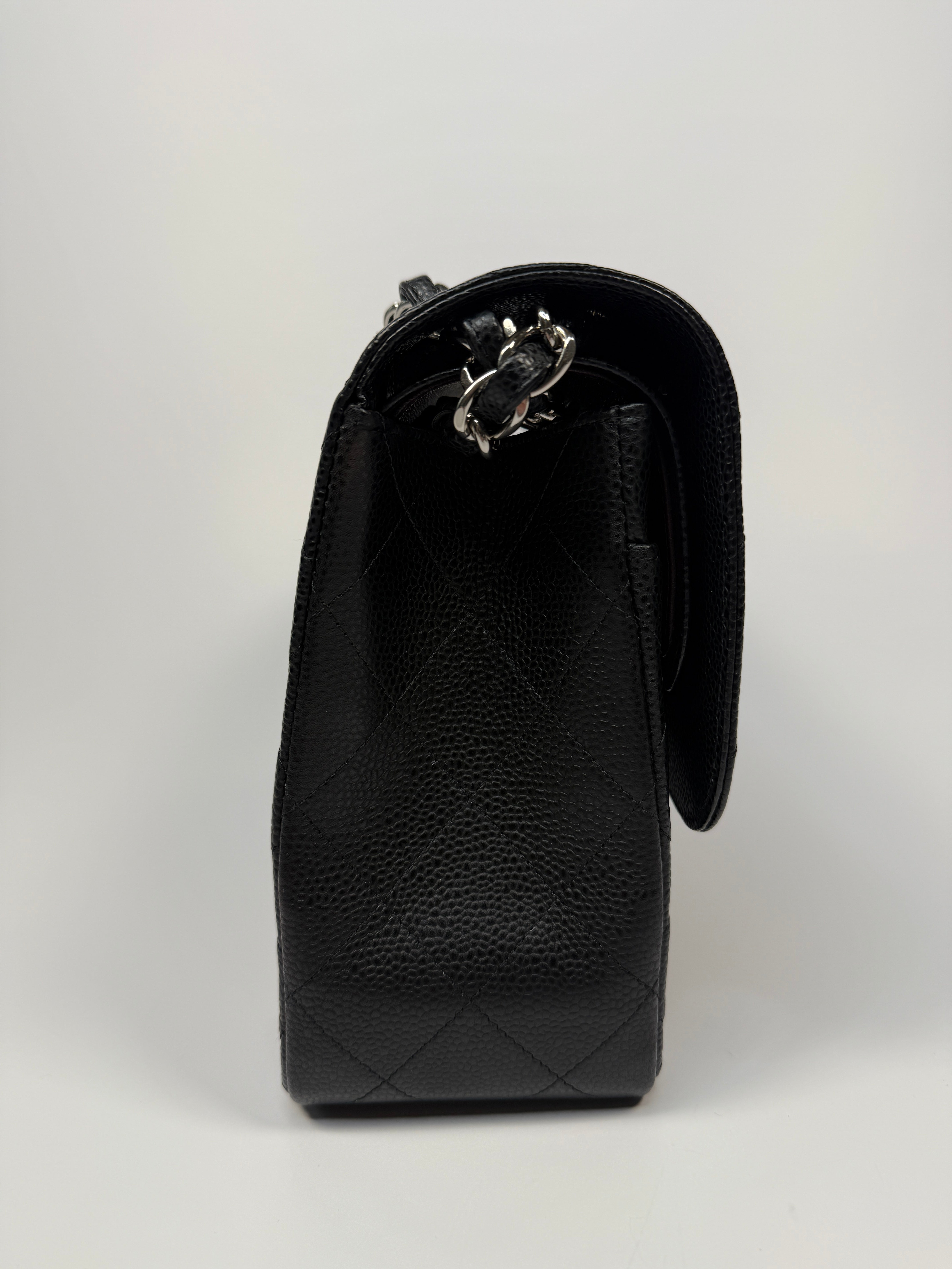 Chanel Classic Jumbo Flap Bag In Black Caviar Leather With Silver Hardware. Authentic and preloved. Excellent condition.