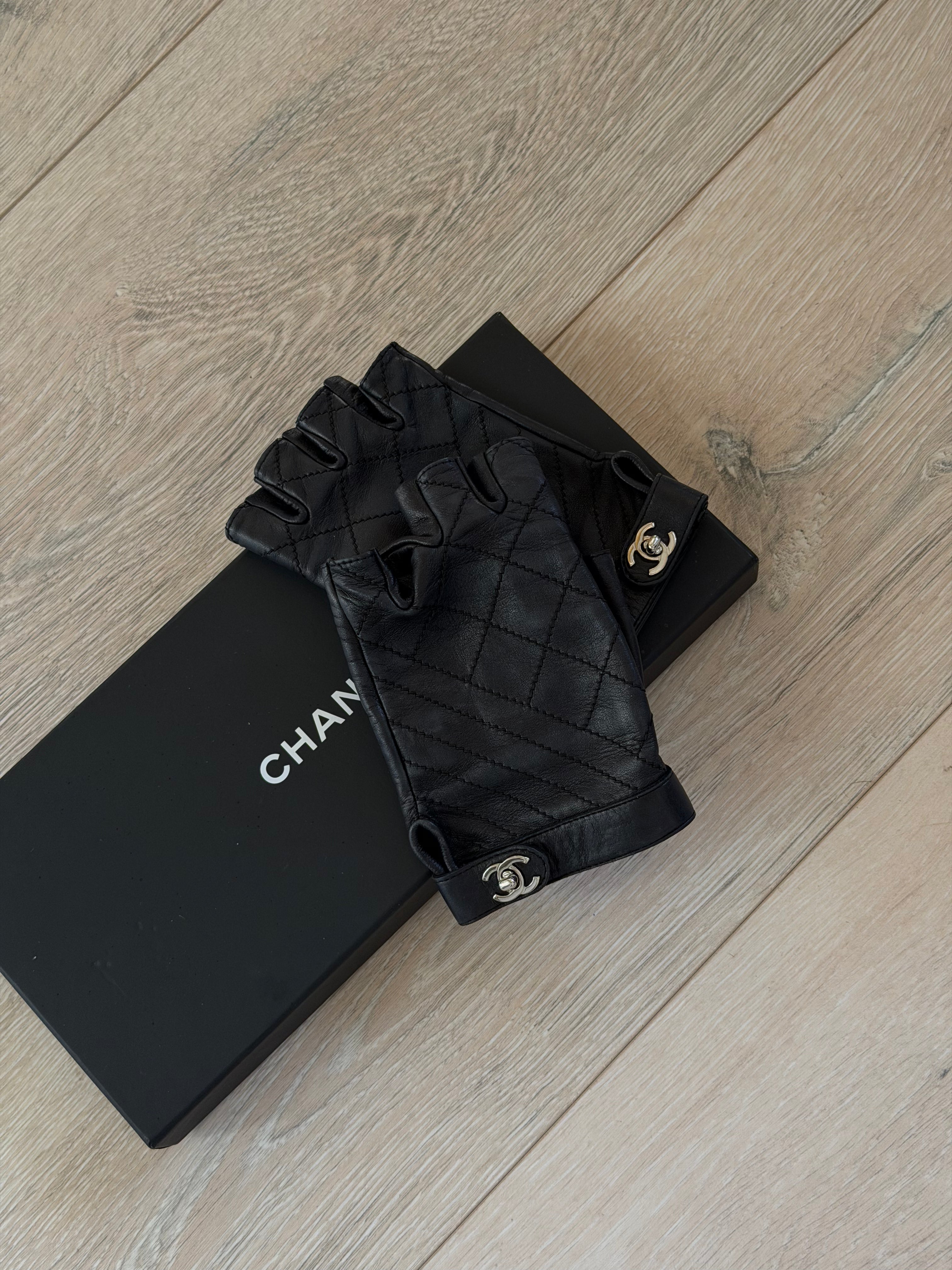 Chanel Black Leather Fingerless Gloves Excellent condition. Authentic and preloved.