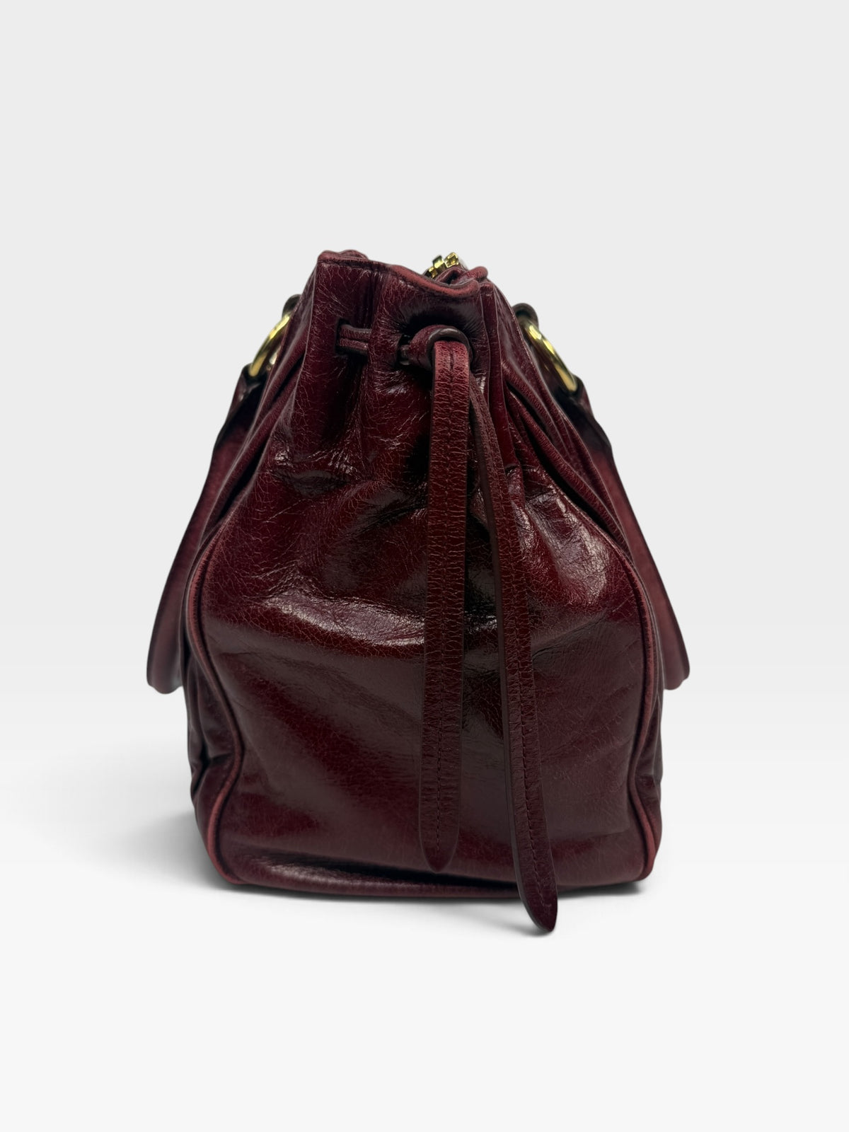 Miu Miu Bauletto Tote Bag In Burgundy Matelasse Leather With Gold Hardware. 100% authentic and pre loved in excellent condition.