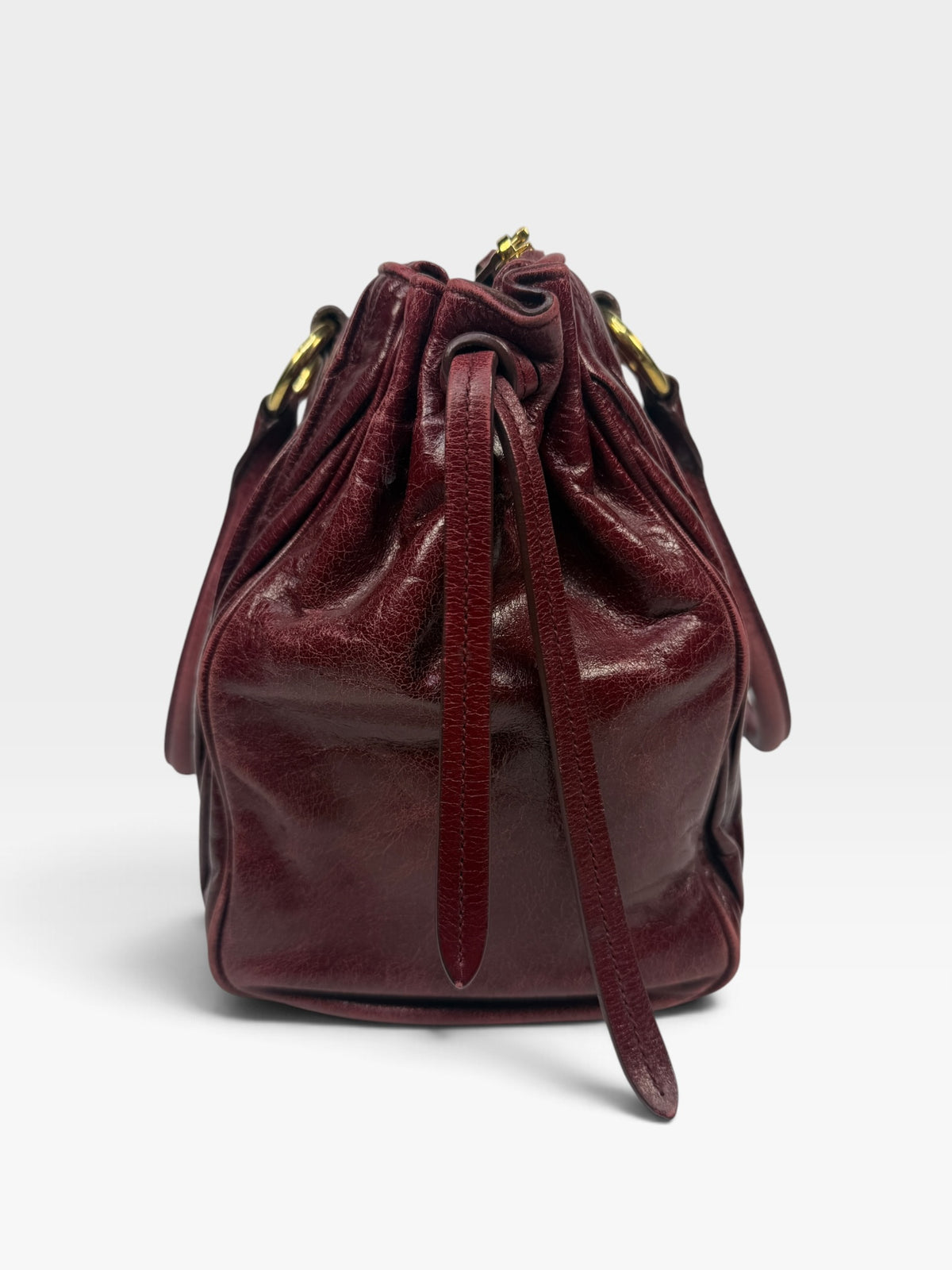 Miu Miu Bauletto Tote Bag In Burgundy Matelasse Leather With Gold Hardware. 100% authentic and pre loved in excellent condition.